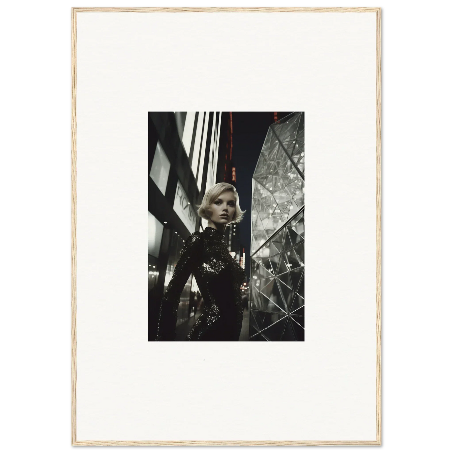 Black and white framed wall art of a woman in an urban setting for stylish room decor