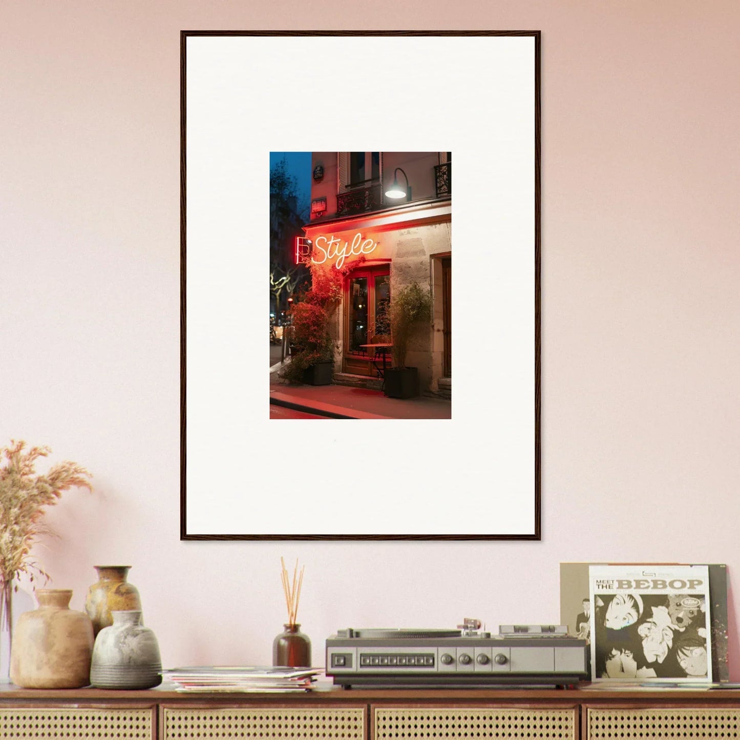 Framed canvas print of a neon-lit storefront showcasing dazzling pavement glow at night