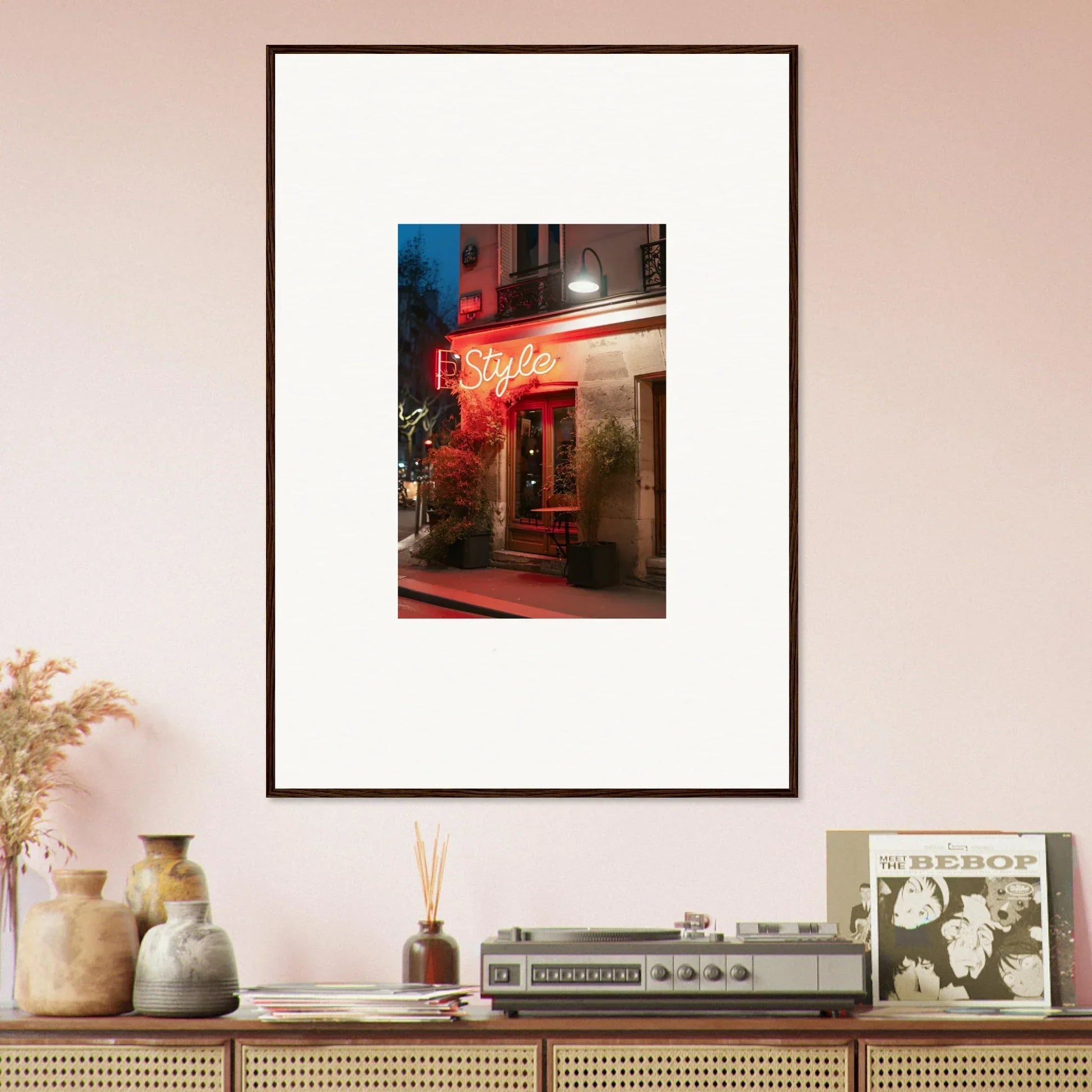 Framed canvas print of a neon-lit storefront showcasing dazzling pavement glow at night