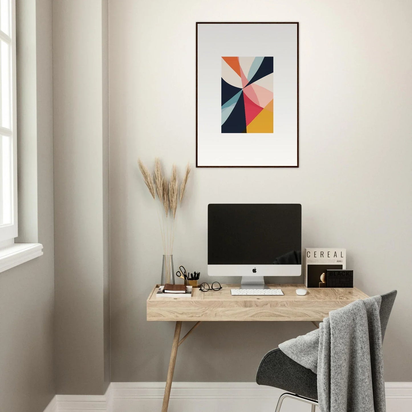 Modern workspace with a minimalist desk and Cosmic Tango Explodes canvas print for room decoration
