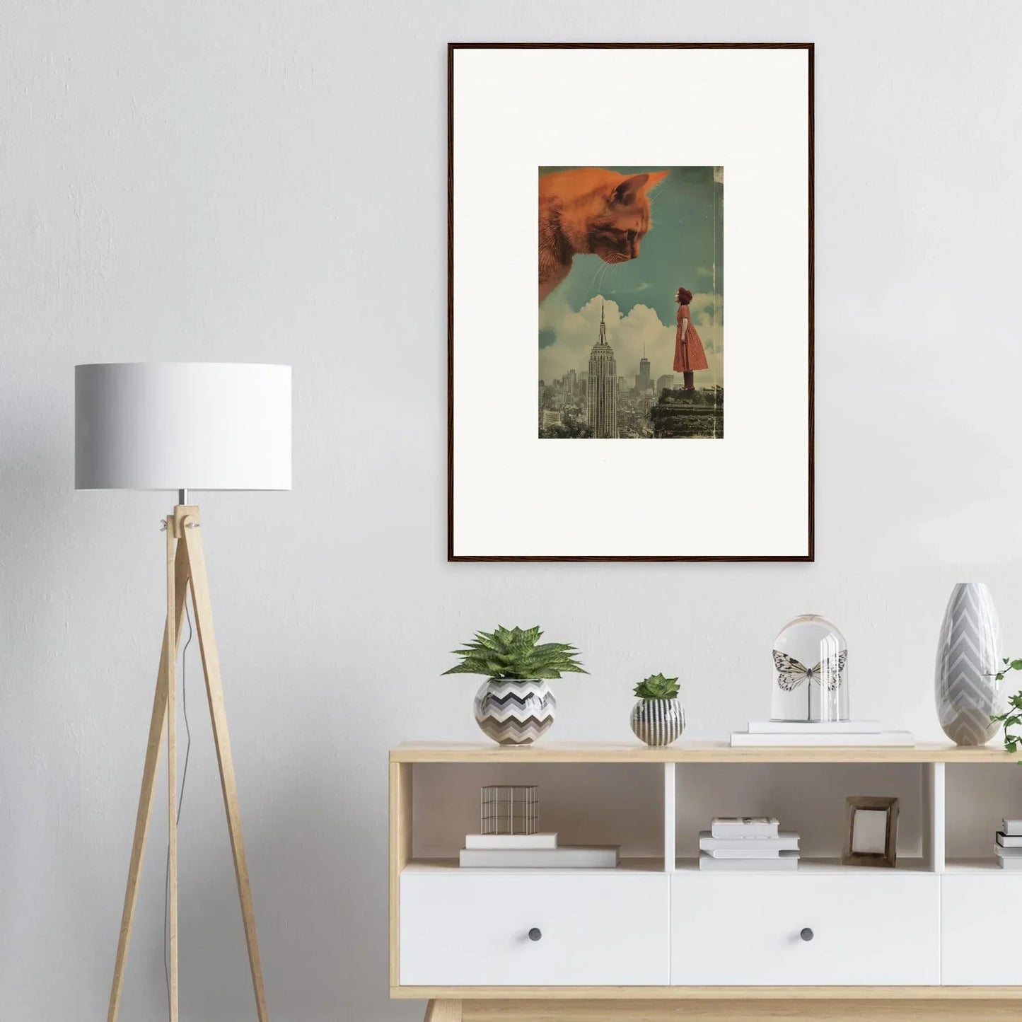 Framed wall art of a surreal cityscape with whimsy glance and a red figure