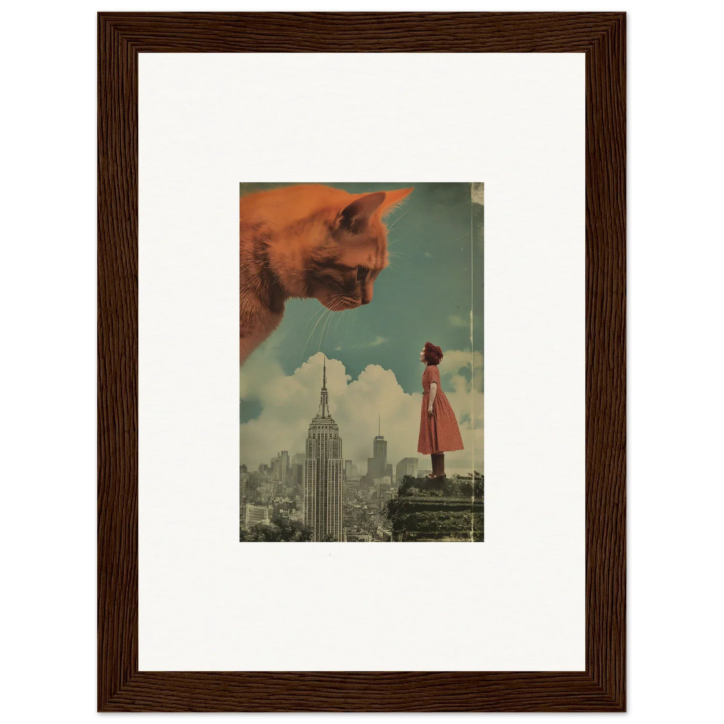 Framed surrealist wall art of a giant cat face over a city, perfect for whimsy glance room decor