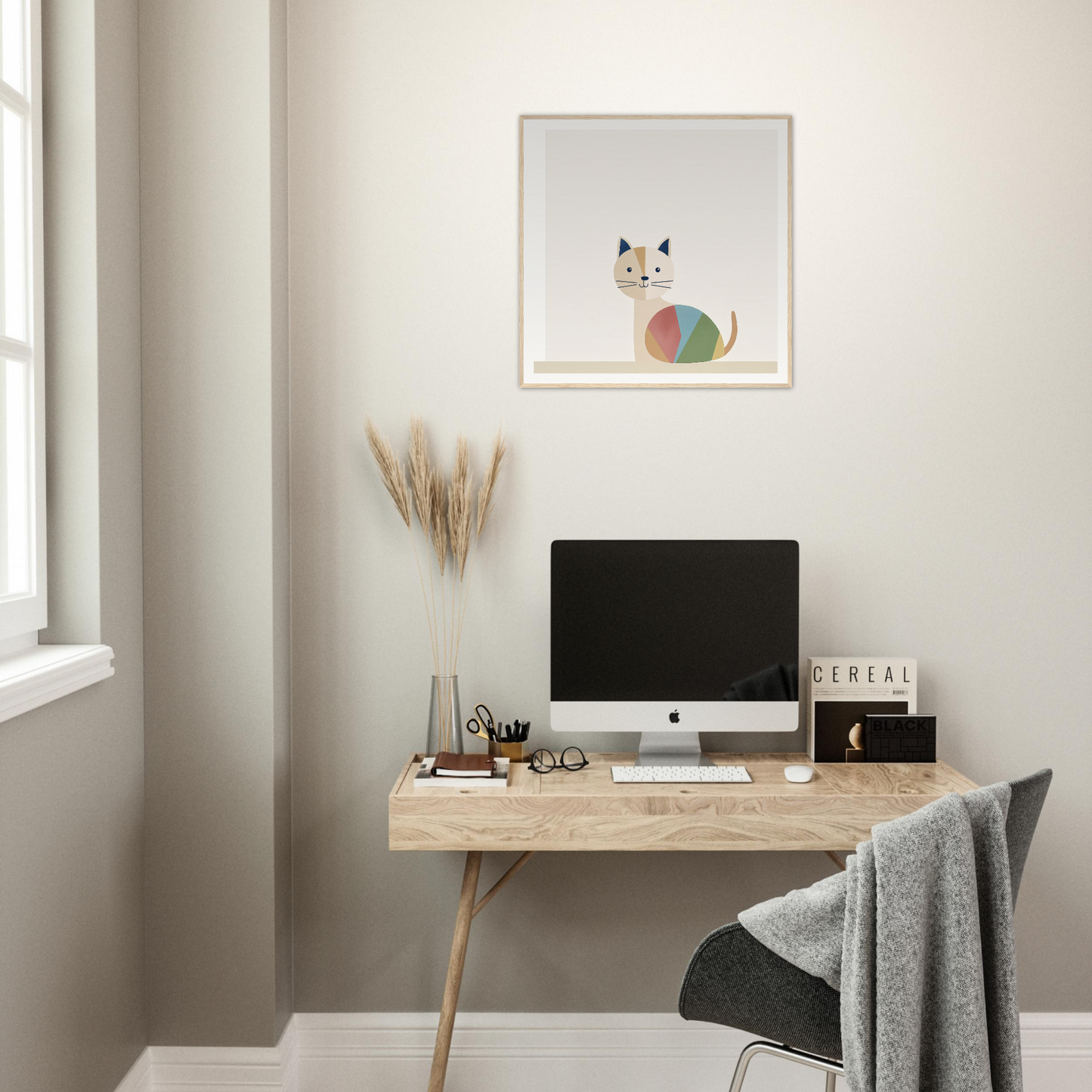 Minimalist wooden desk featuring an iMac and office accessories with Curious Cat Balances
