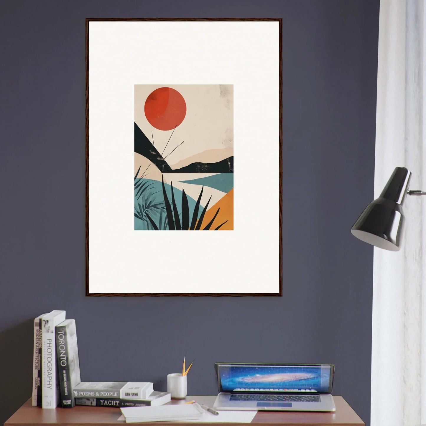 Framed wall art with a red sun over minimalist mountains in turquoise and yellow tones