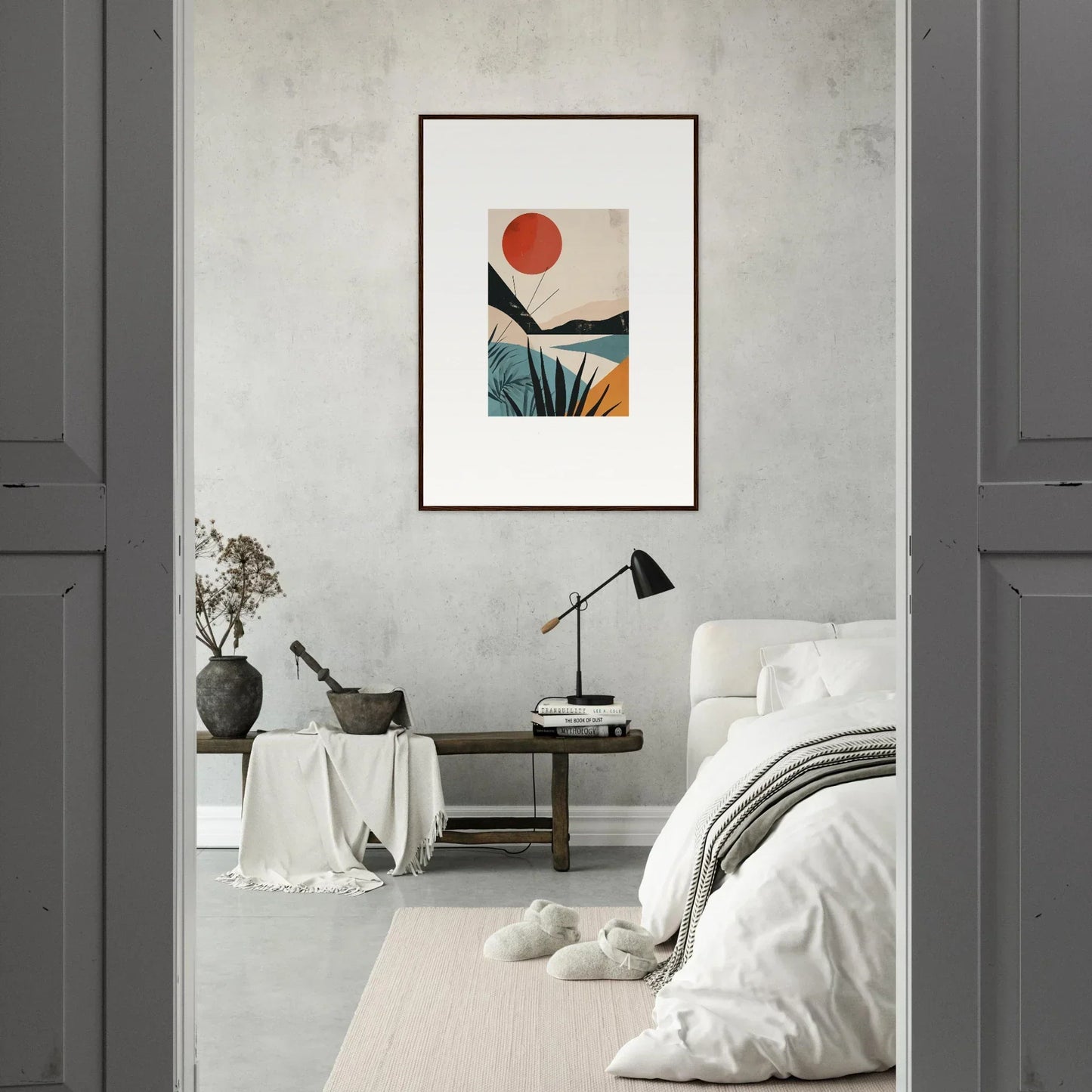 Framed wall art featuring a vibrant red sun over mountains, water, and tropical foliage