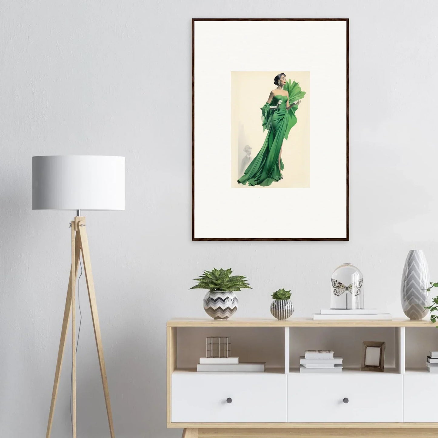 Framed fashion illustration of a figure in an elegant emerald green gown for Draped Would Dream
