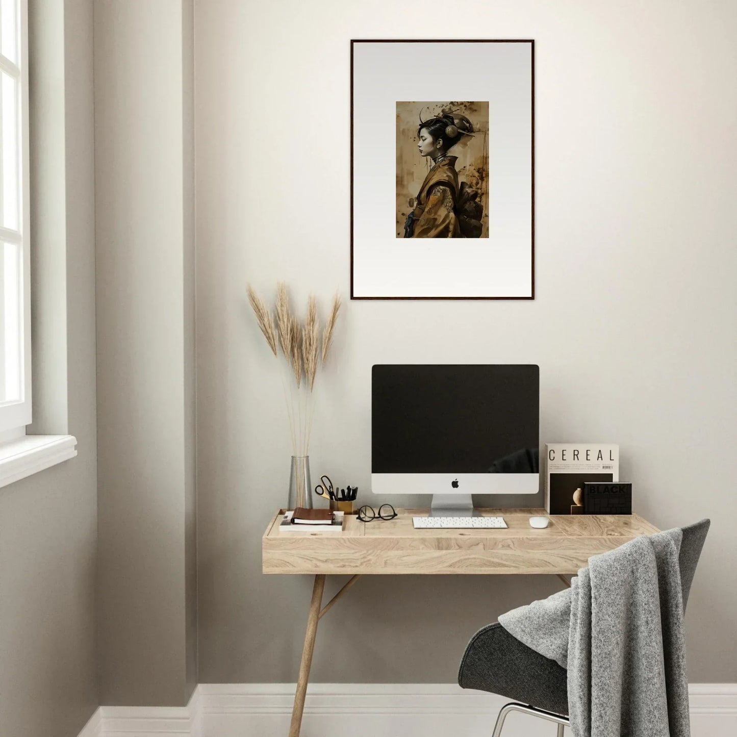 Minimalist wooden desk with computer and Whisper Muse canvas print for stylish room decoration