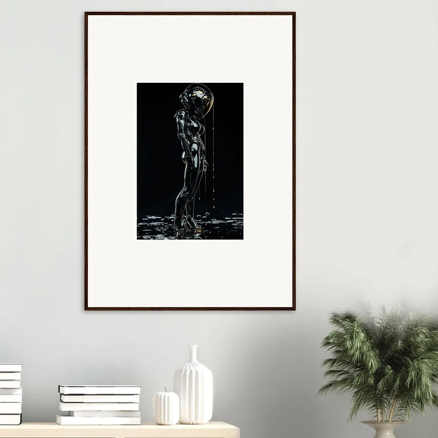 Framed black and white artwork depicting a silhouette of a figure with water cascading over them.