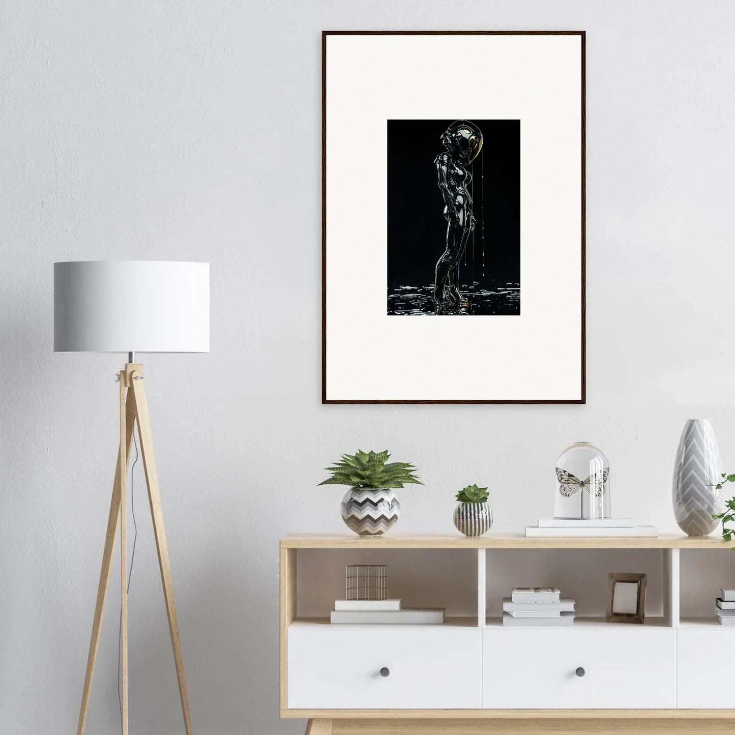 Framed black and white artwork depicting a silhouetted figure in a dramatic pose.