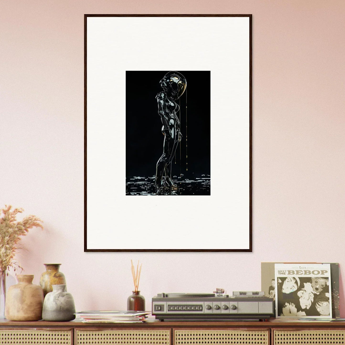 Framed black and white artwork depicting a nude figure with water cascading over their body.