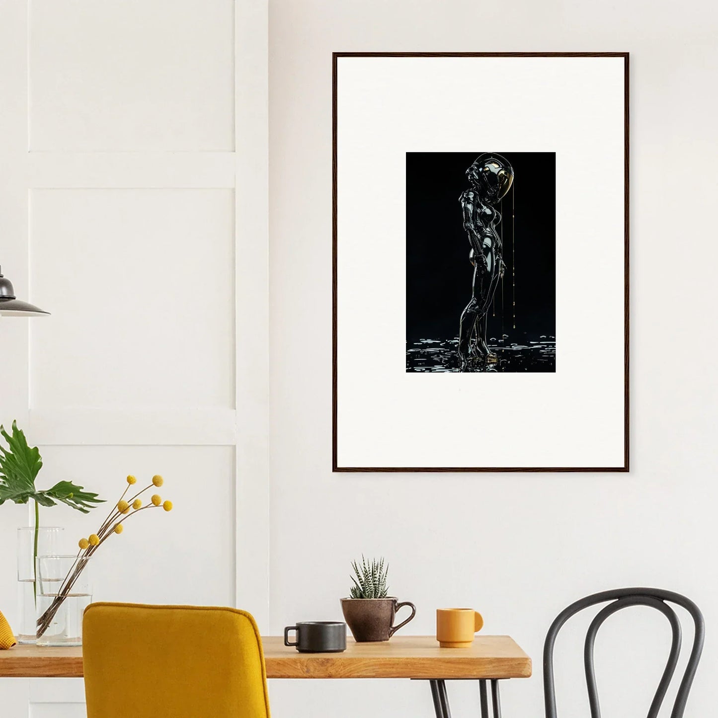 Framed black and white artwork depicting a silhouette of a human figure with water droplets.