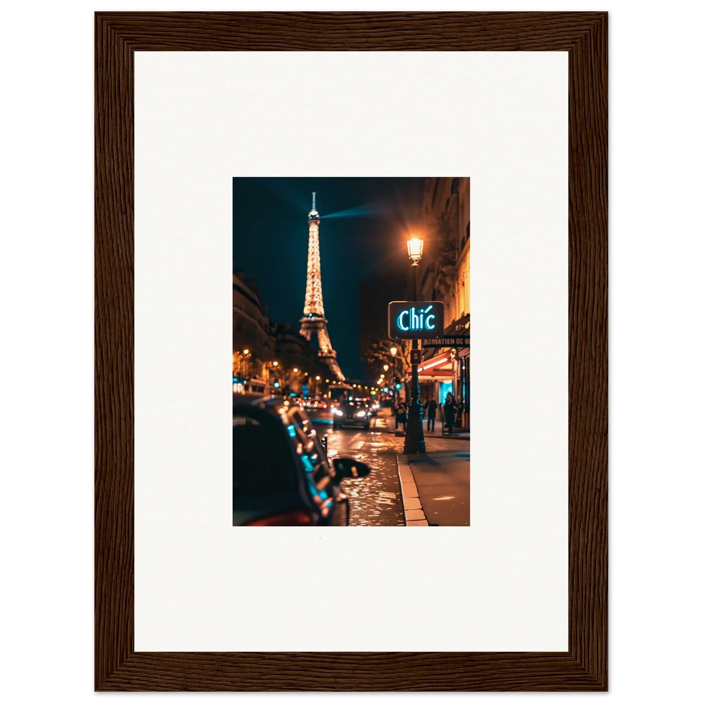 Framed photograph of a Paris street at night with the Eiffel Tower, perfect wall art