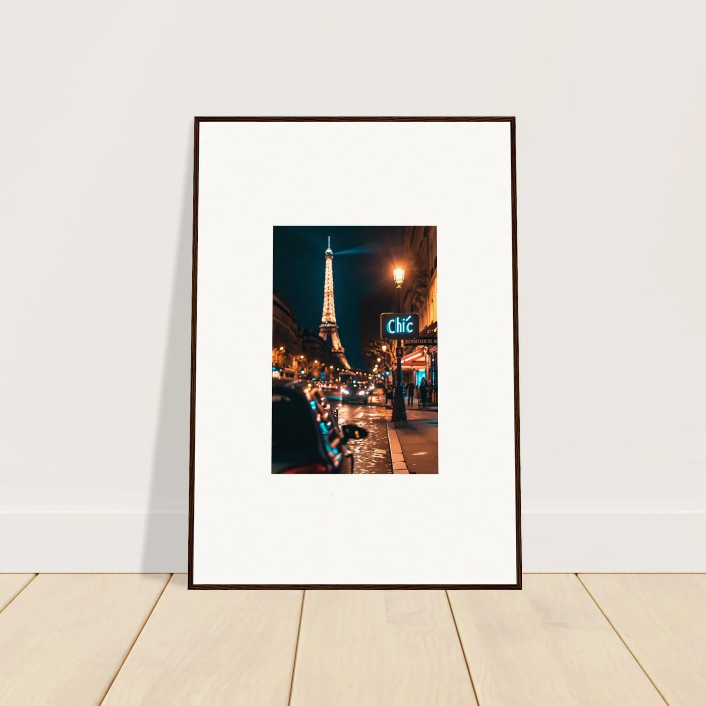 Framed wall art of a Paris street at night with the glowing Eiffel Tower for room decoration