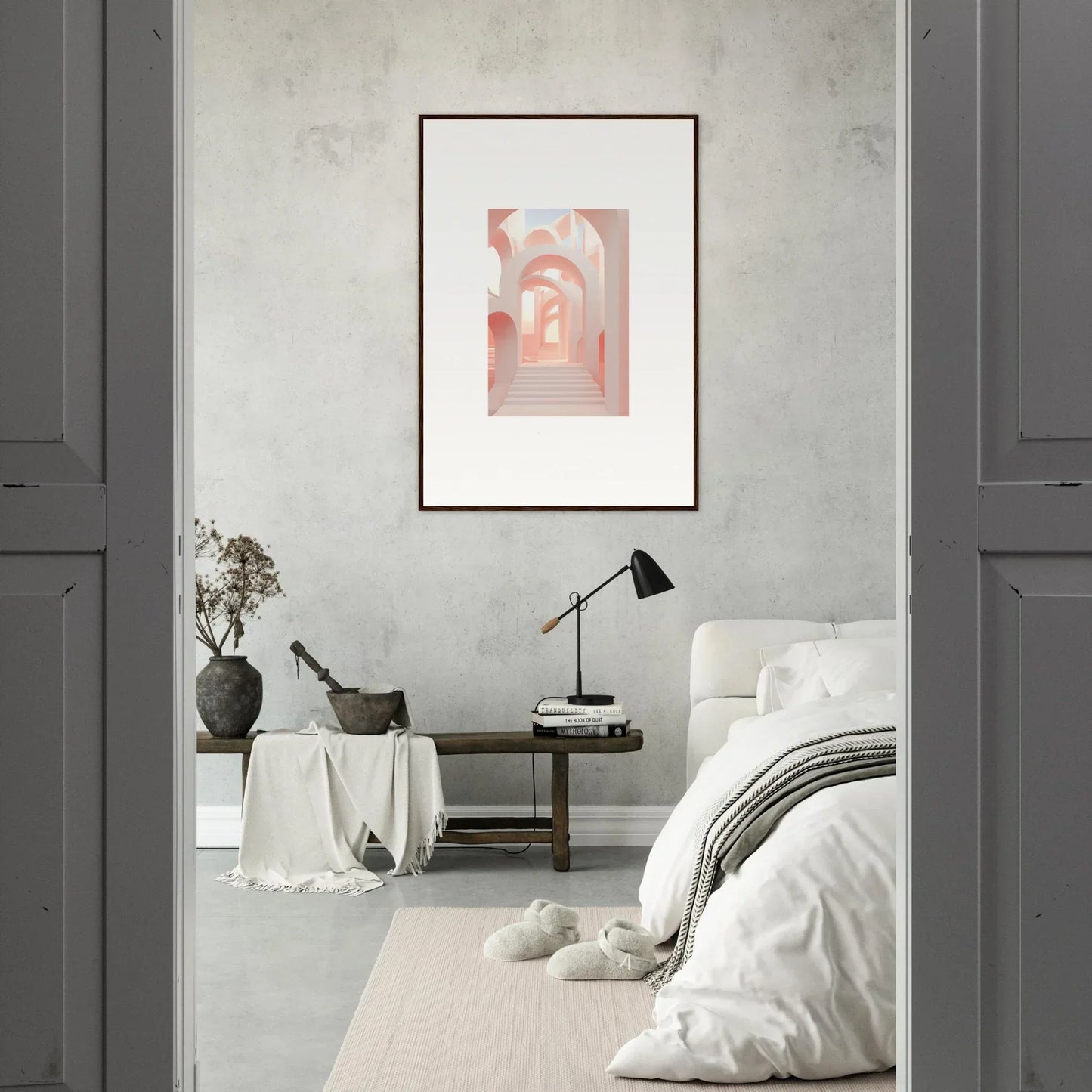 Framed artwork depicting arched passageways in soft pink tones.