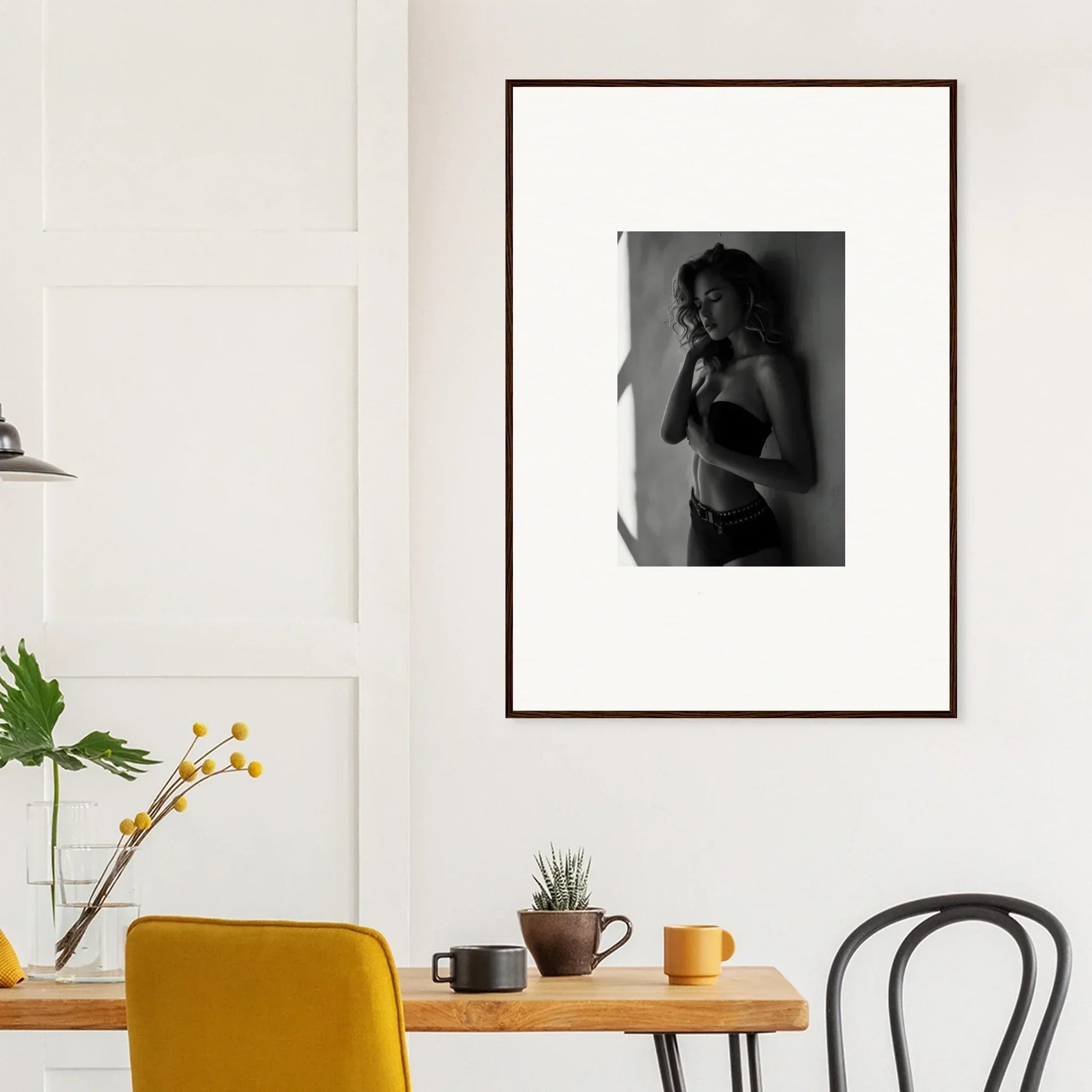 Framed black and white photograph of a person in an intimate pose.