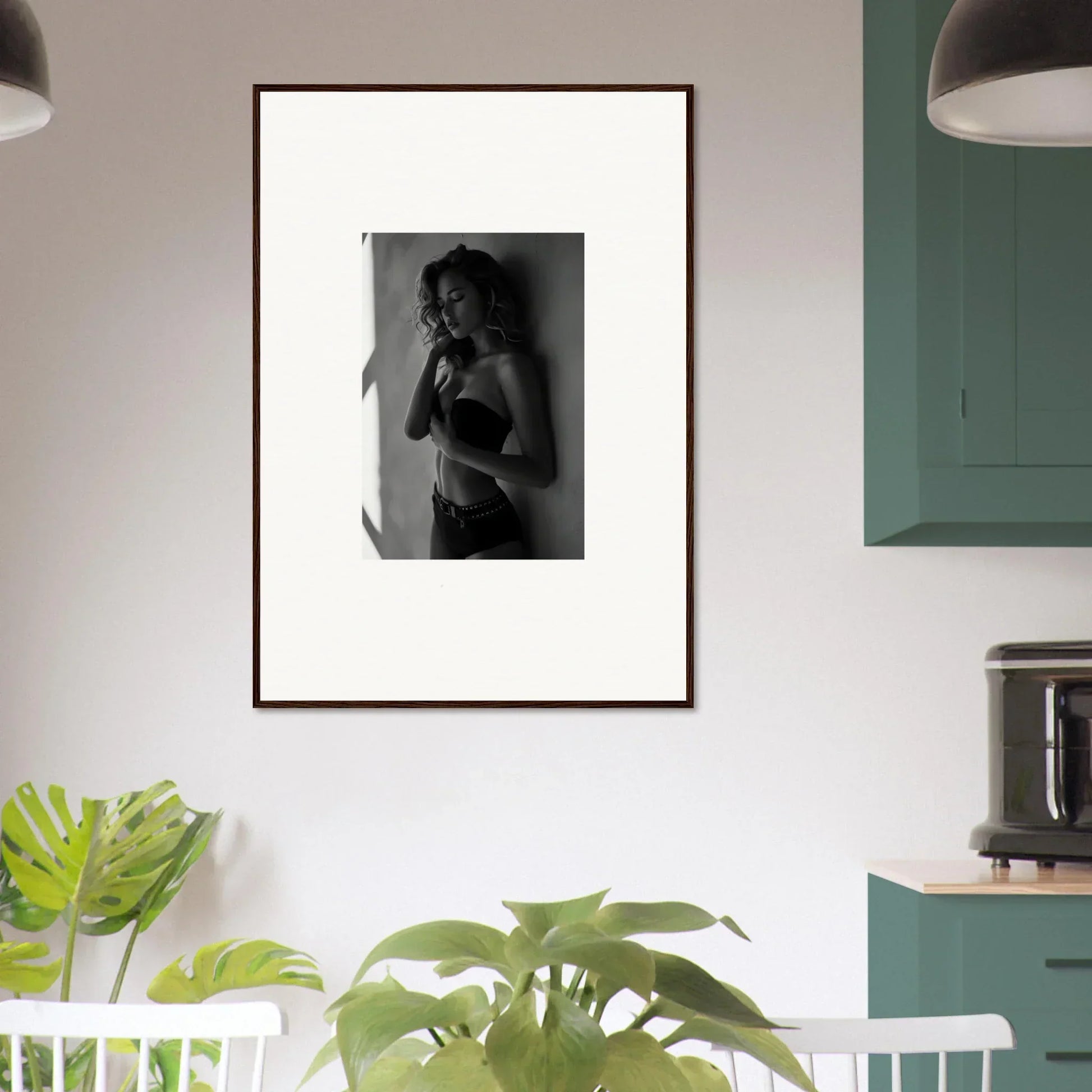 Framed black and white photograph of a woman in lingerie.