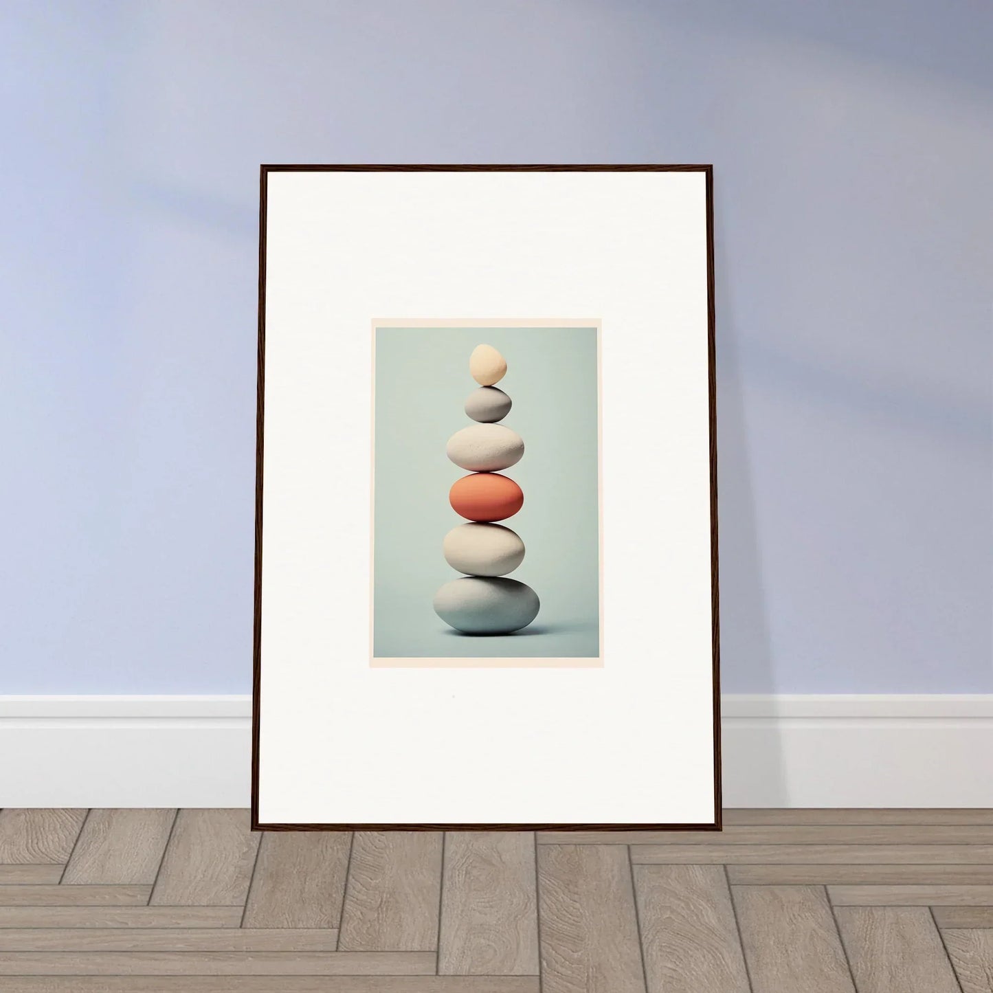 Framed art print of balanced stones with orange rock in Egg Wanders Reverie