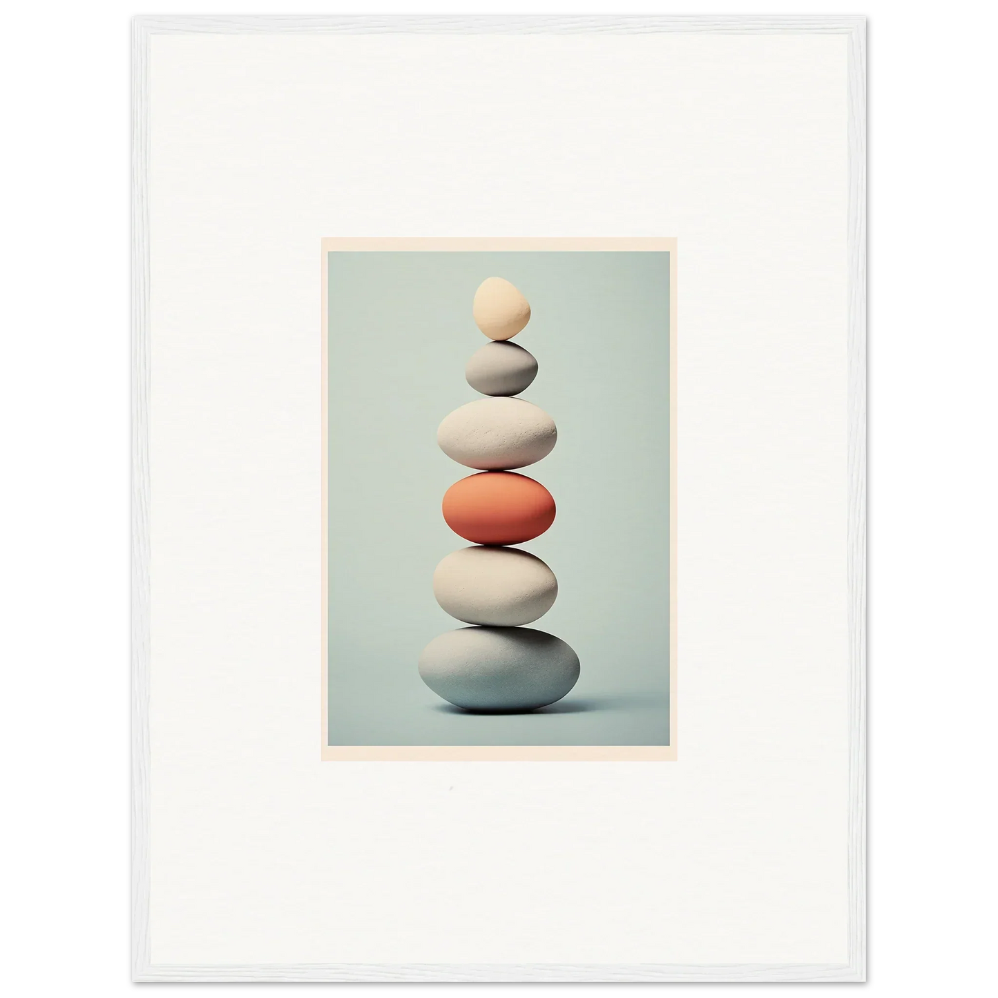 Balanced stones with one coral rock, showcasing Egg Wanders Reverie special edition art