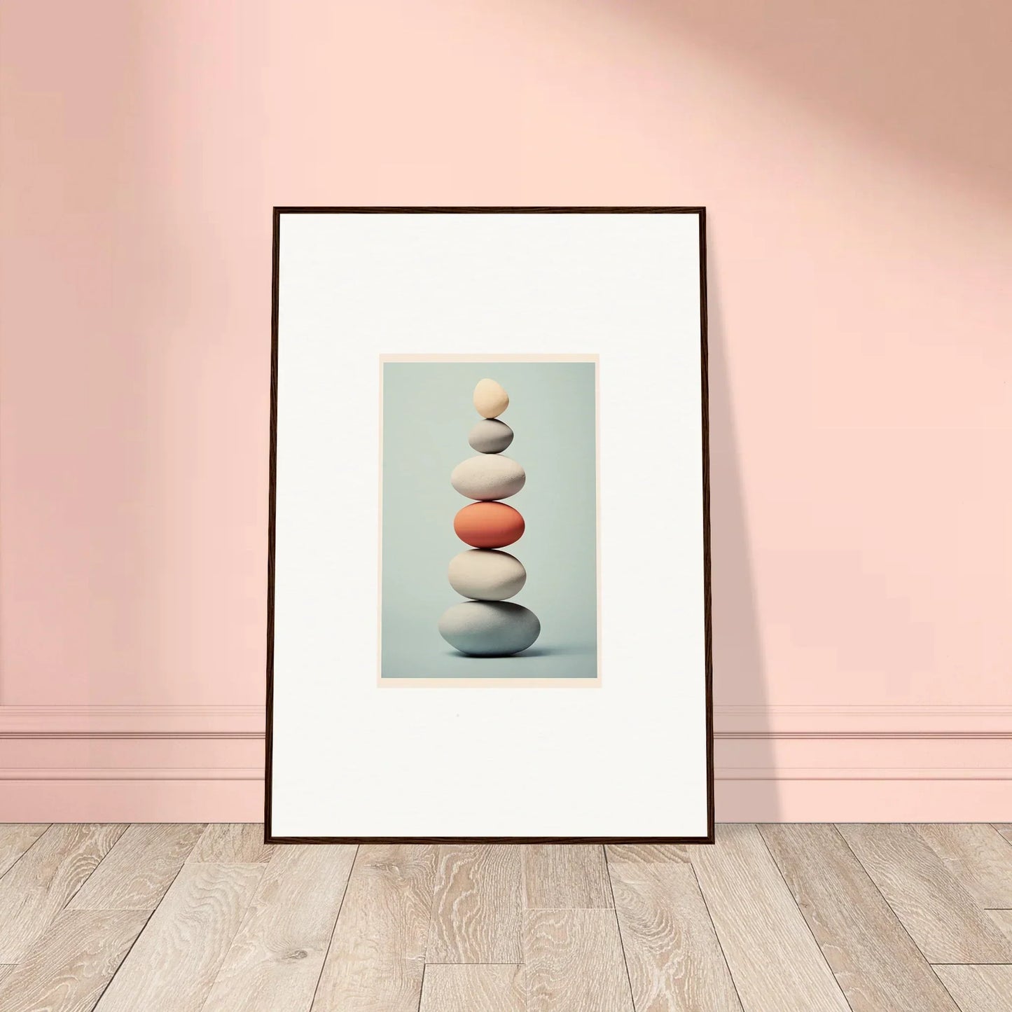 Balanced stone stack with an orange gem in Egg Wanders Reverie framed wall art