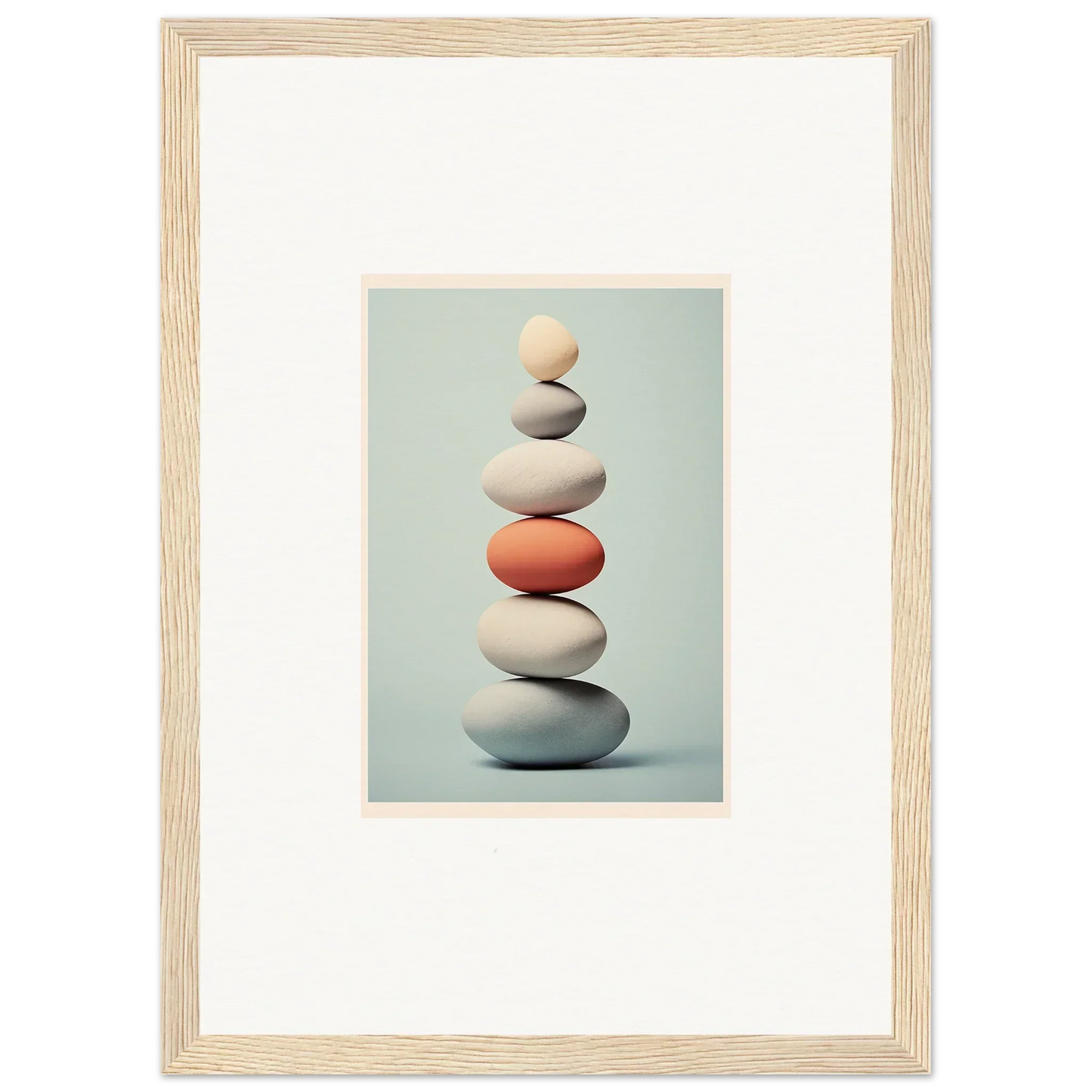 Stack of balanced stones with an orange stone in the middle from Egg Wanders Reverie