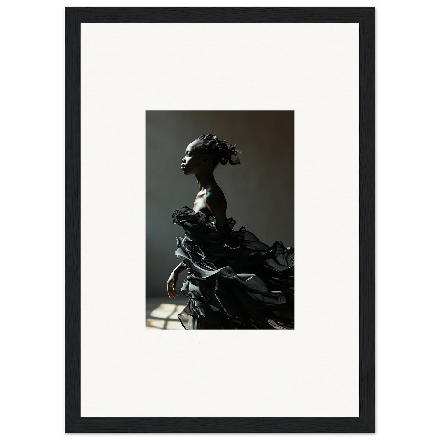 Dramatic sculpture of a figure with an elaborate headdress and flowing, textured garment.