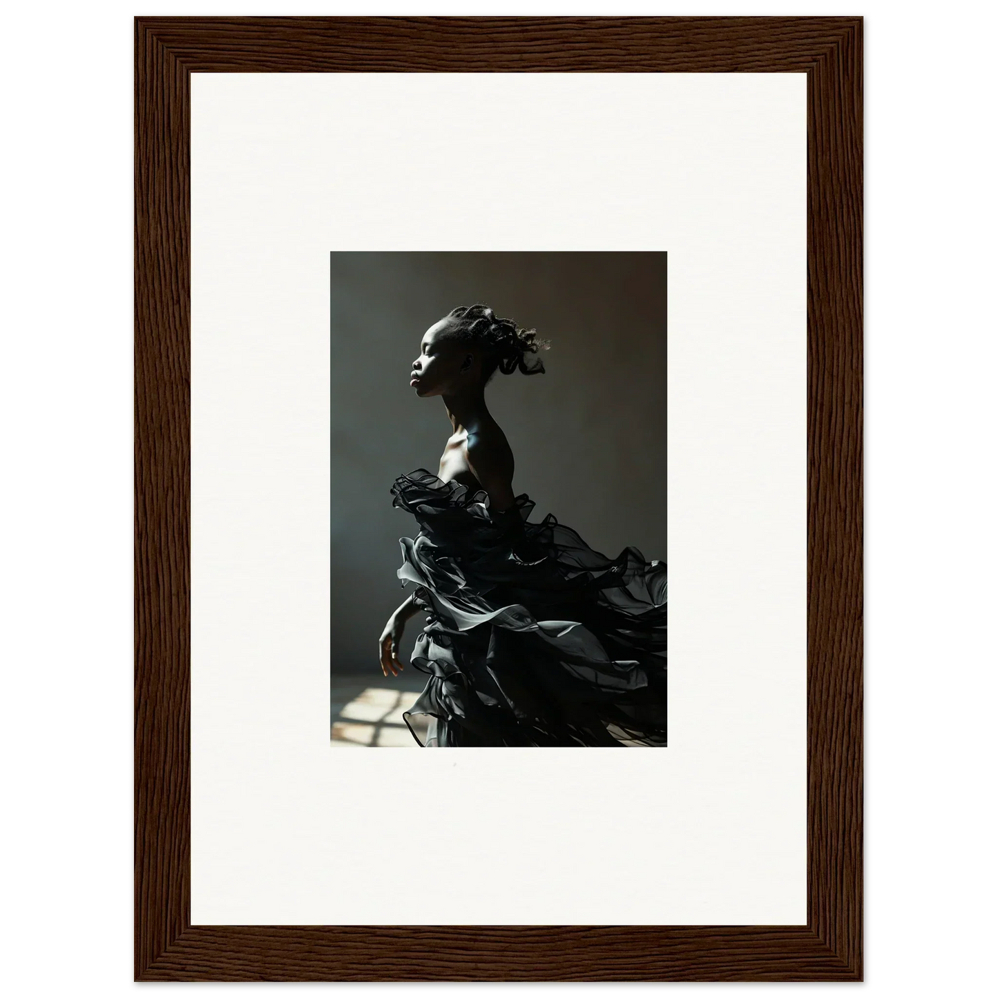 Dramatic sculpture of a figure with flowing, billowing forms.