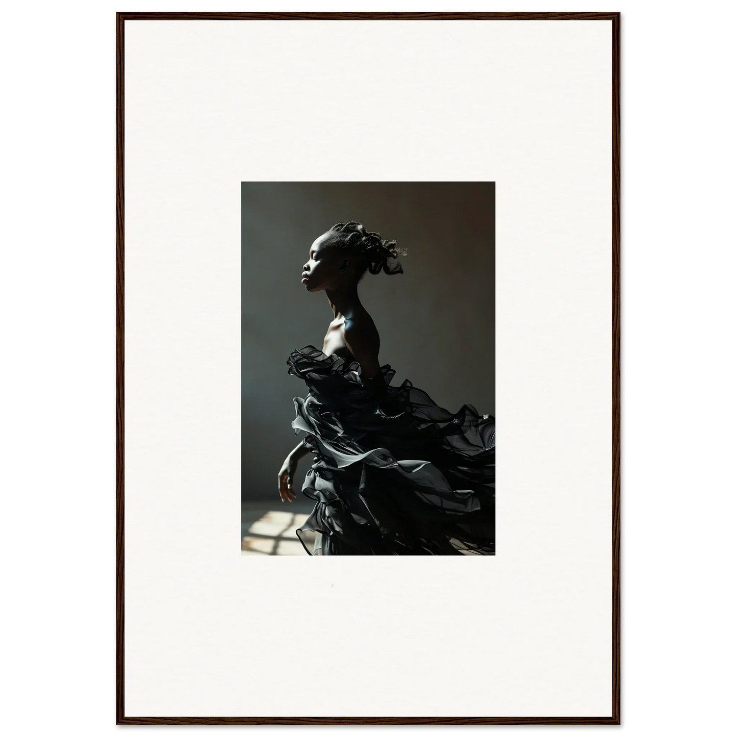 Dramatic sculpture of a figure with flowing, billowing fabric.