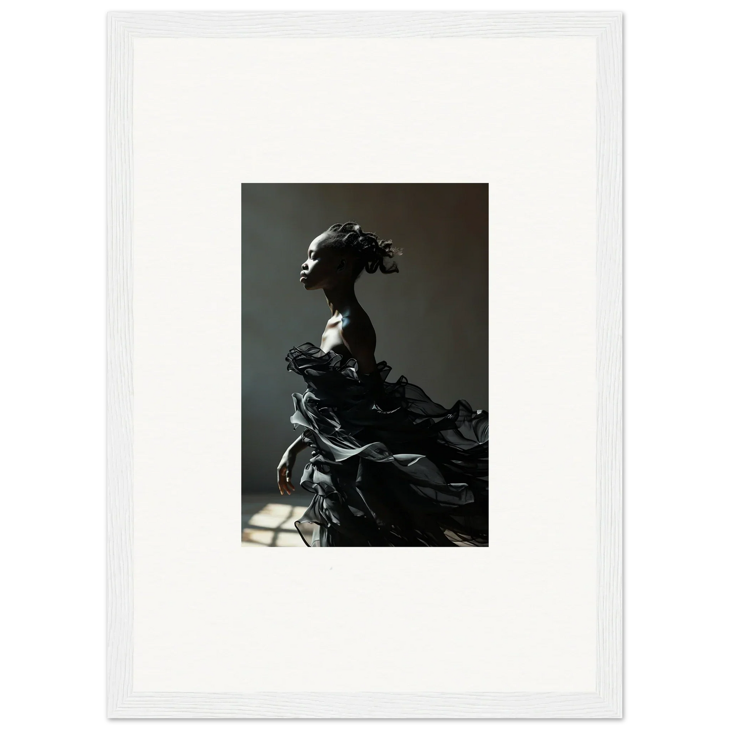 Dramatic sculpture of a figure with flowing, billowing fabric.