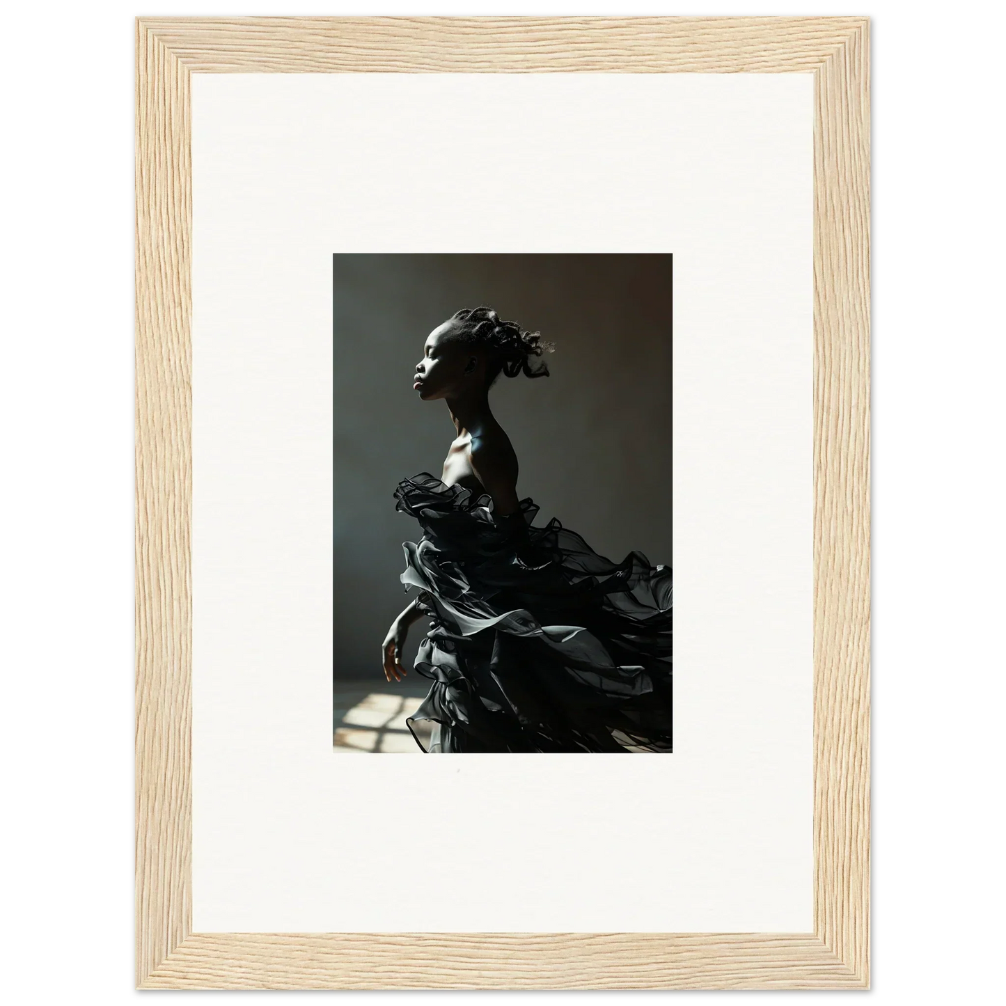 Dramatic sculpture of a figure with flowing, billowing forms.