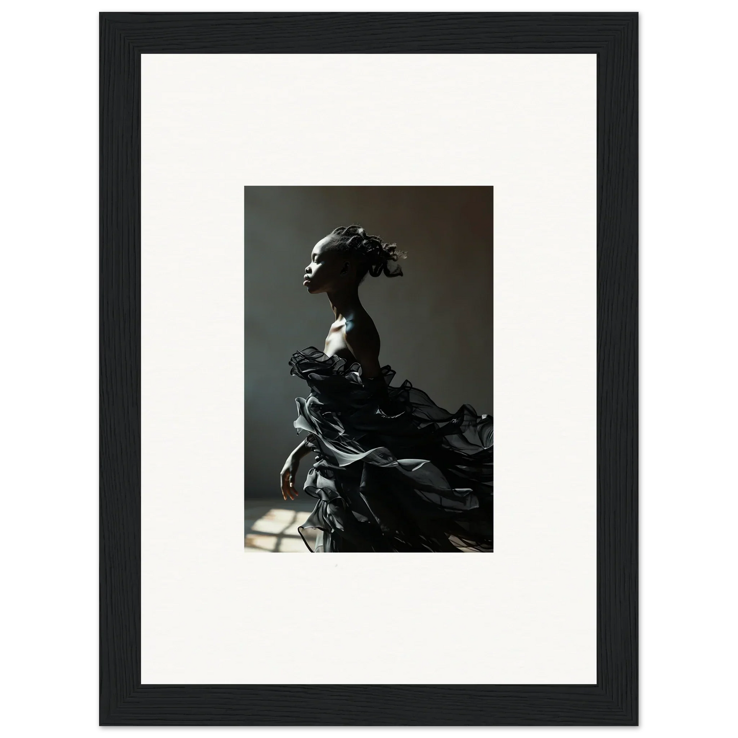Dramatic sculpture of a figure with flowing, billowing forms.
