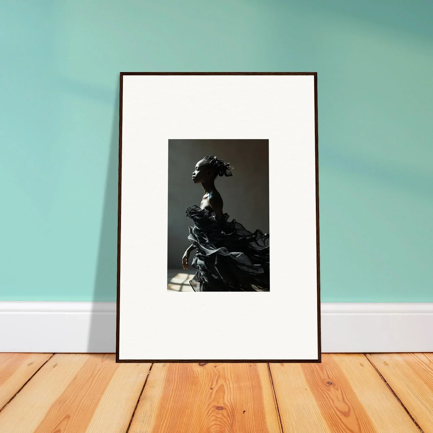 Framed black and white photograph of a person in elaborate historical costume.