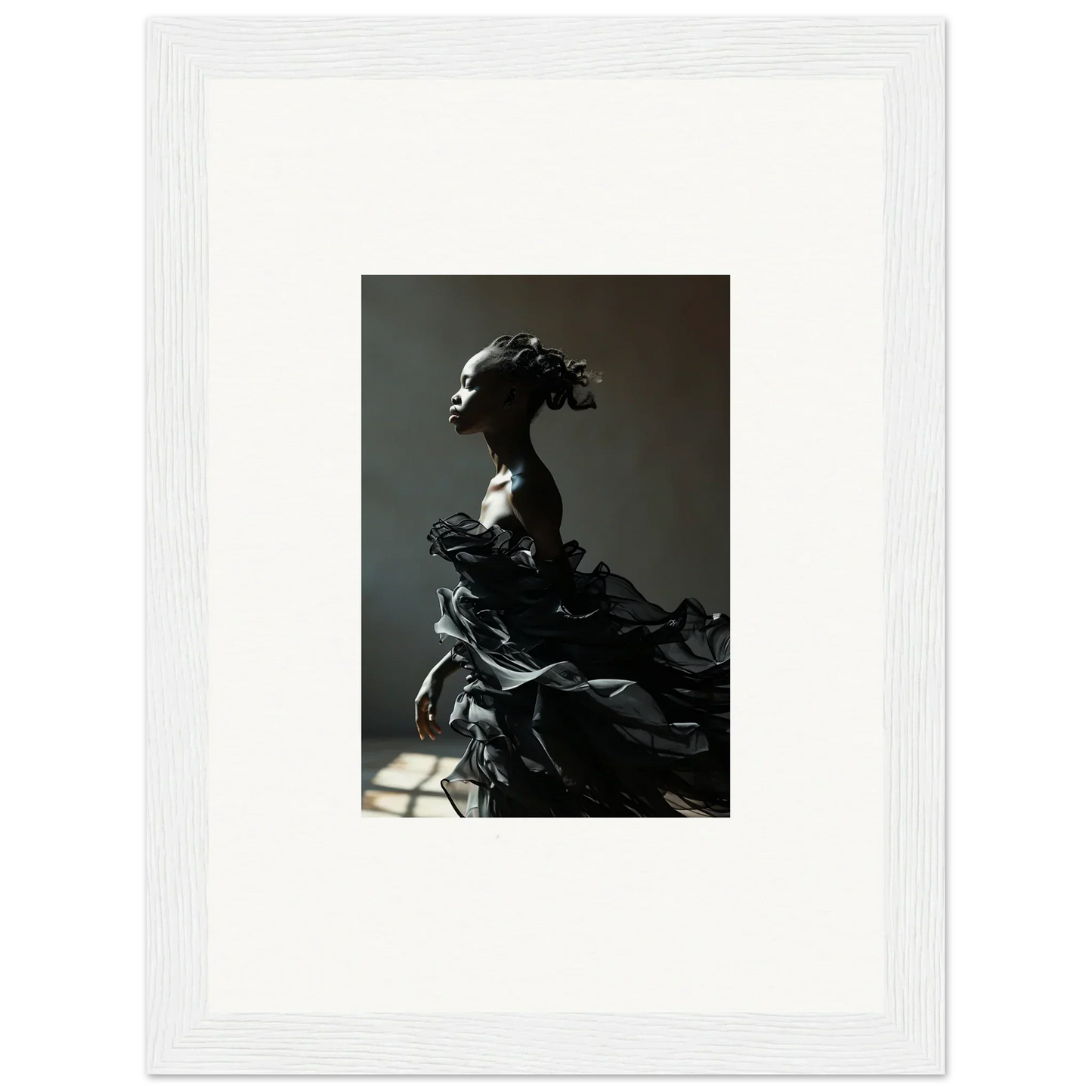 Dramatic sculpture of a figure with flowing, billowing forms.