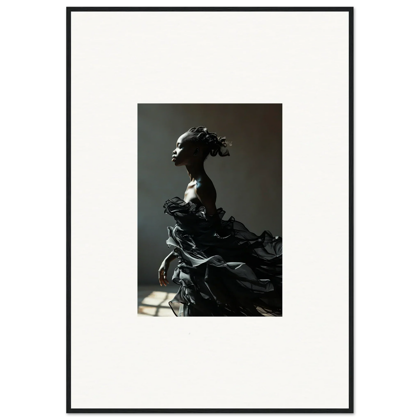 Dramatic black sculpture of a figure with flowing, billowing forms.