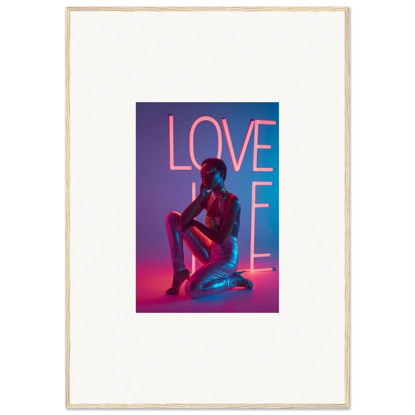 Framed canvas print of neon rapture with ’LOVE’ sign and silhouetted figure in pink blue