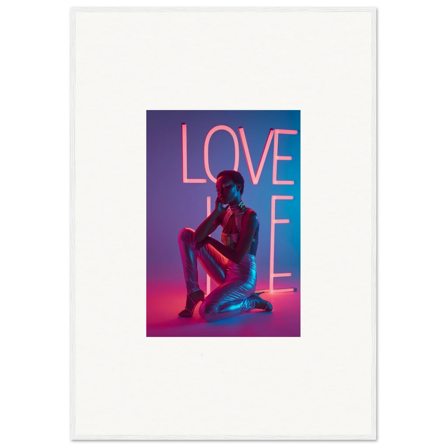 Neon Rapture canvas print of a person kneeling under vibrant pink LOVE lettering
