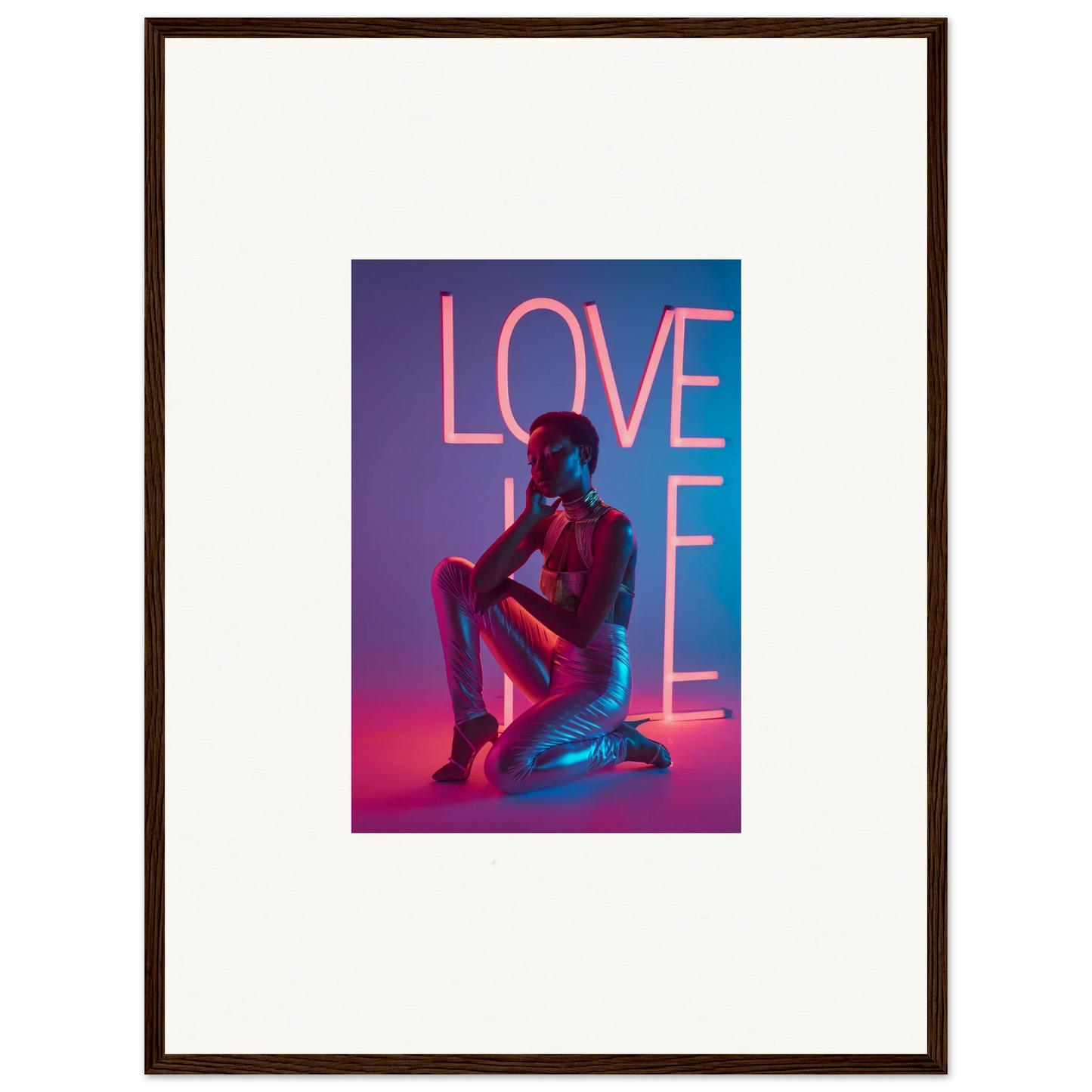 Framed canvas print of neon rapture LOVE sign with a silhouetted figure in pink and blue