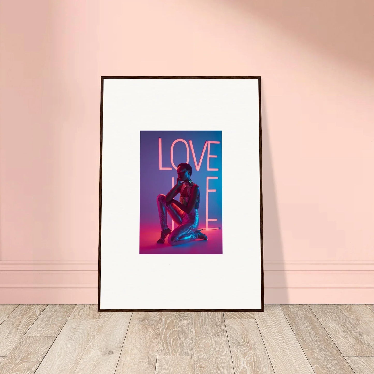 Vibrant canvas print of a neon rapture ’LOVE’ sign and seated figure for cool room decoration