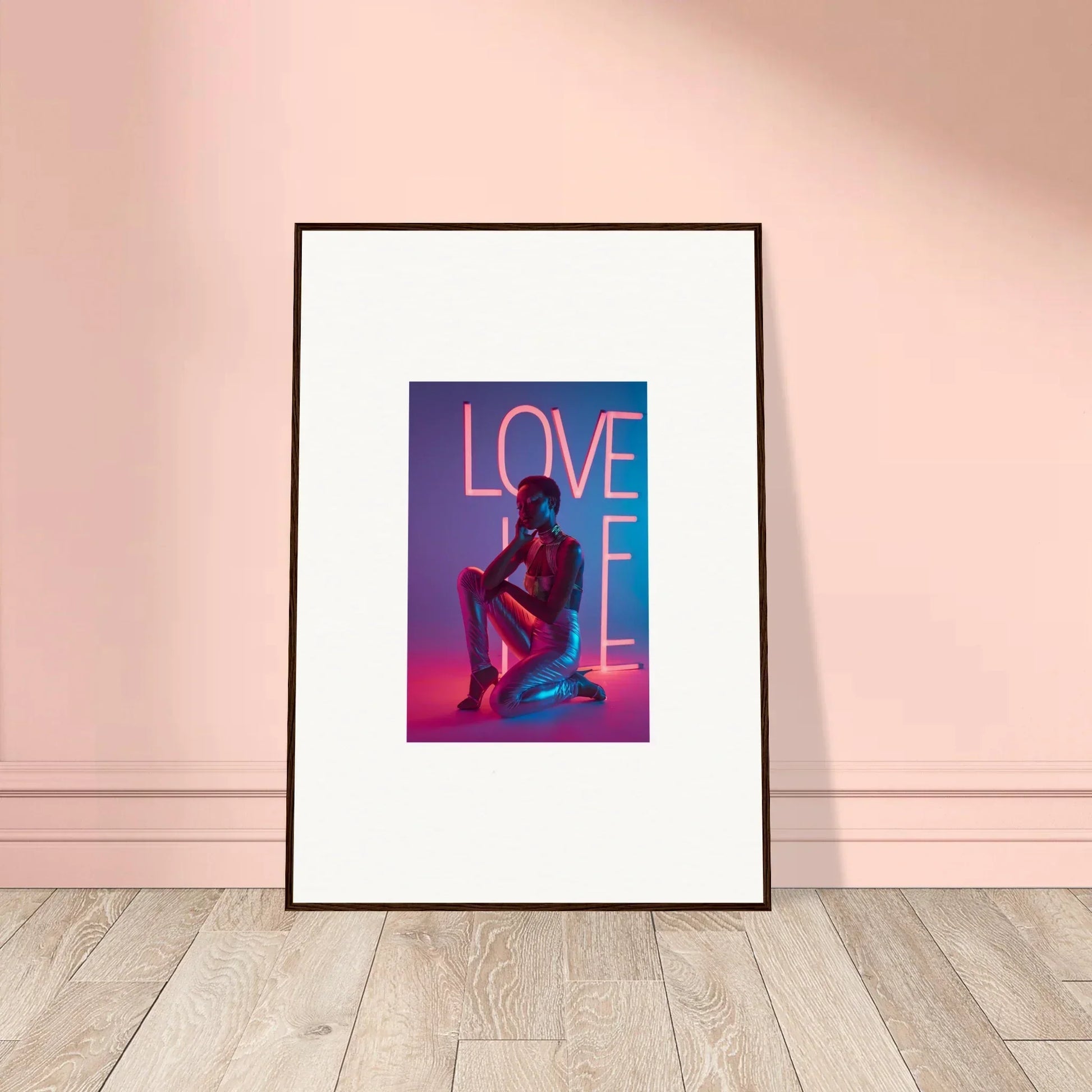 Vibrant canvas print of a neon rapture ’LOVE’ sign and seated figure for cool room decoration