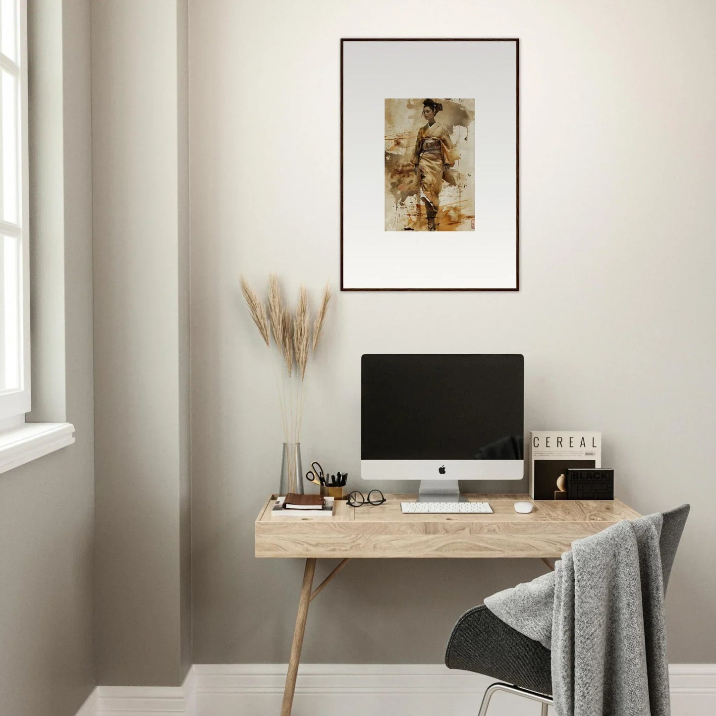 Minimalist wooden desk with computer monitor and canvas whisper framed wall art above