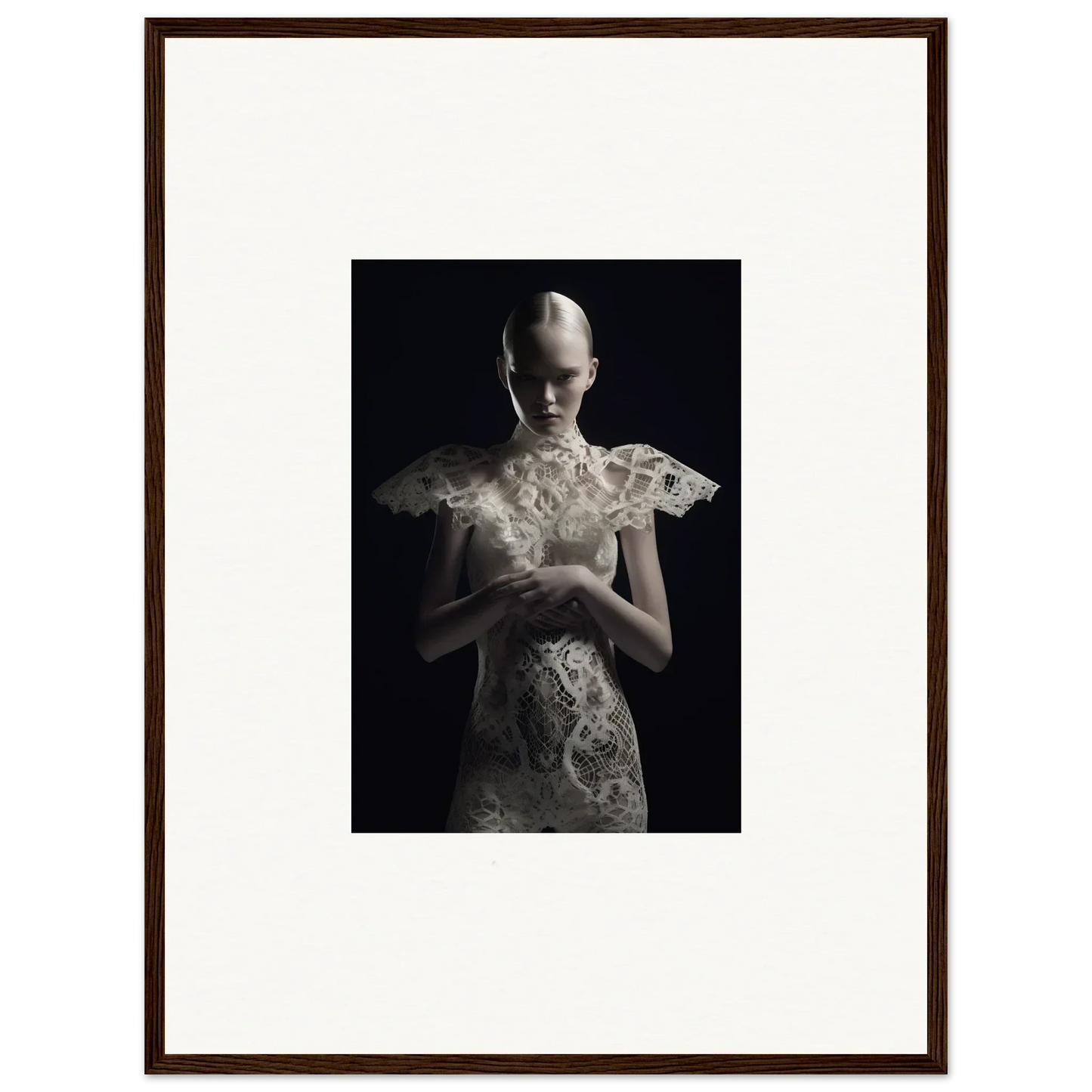 Framed black and white photograph of a person in lace echoes garment for room decor