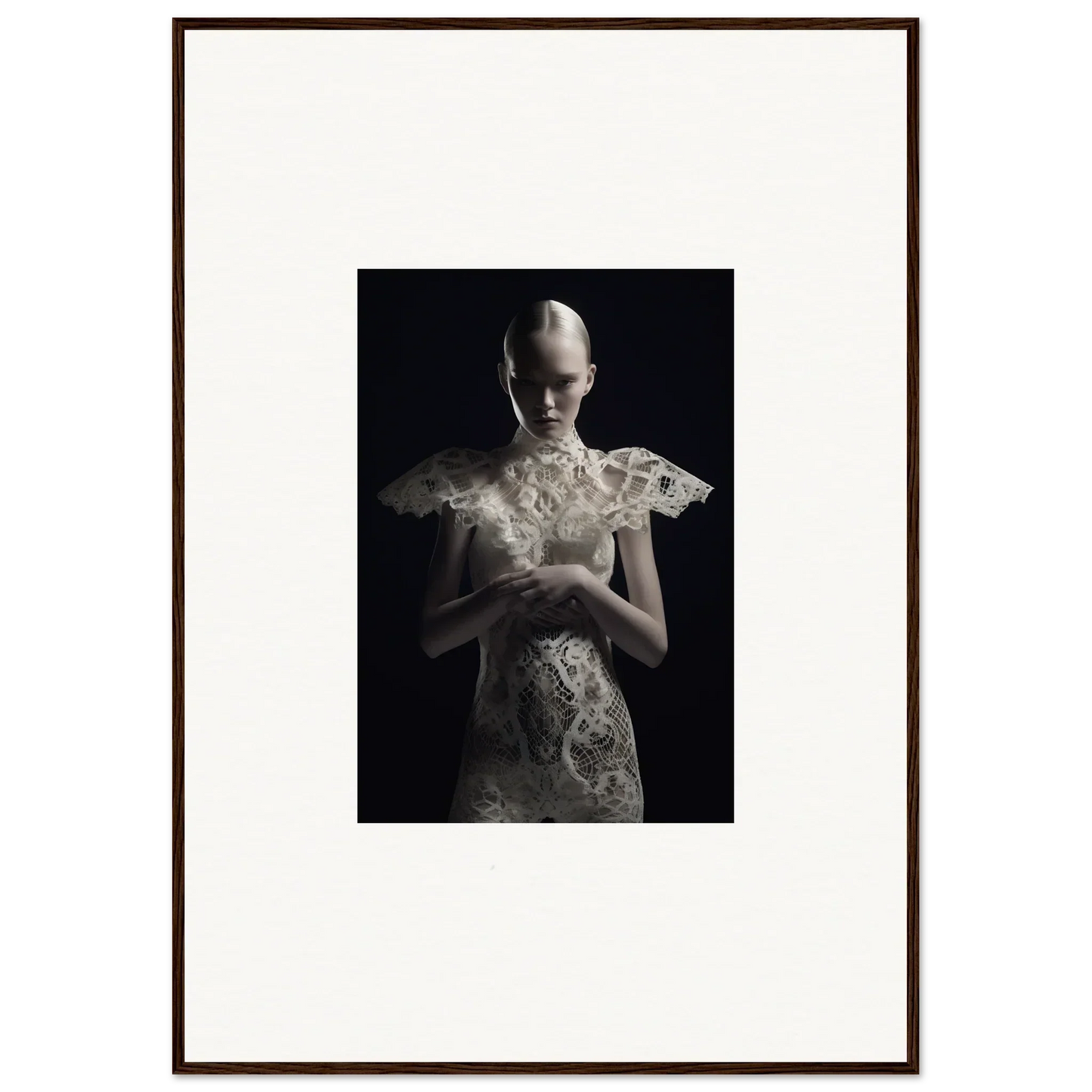 Framed black and white wall art of a figure in ornate white garment, Lace Echoes decor