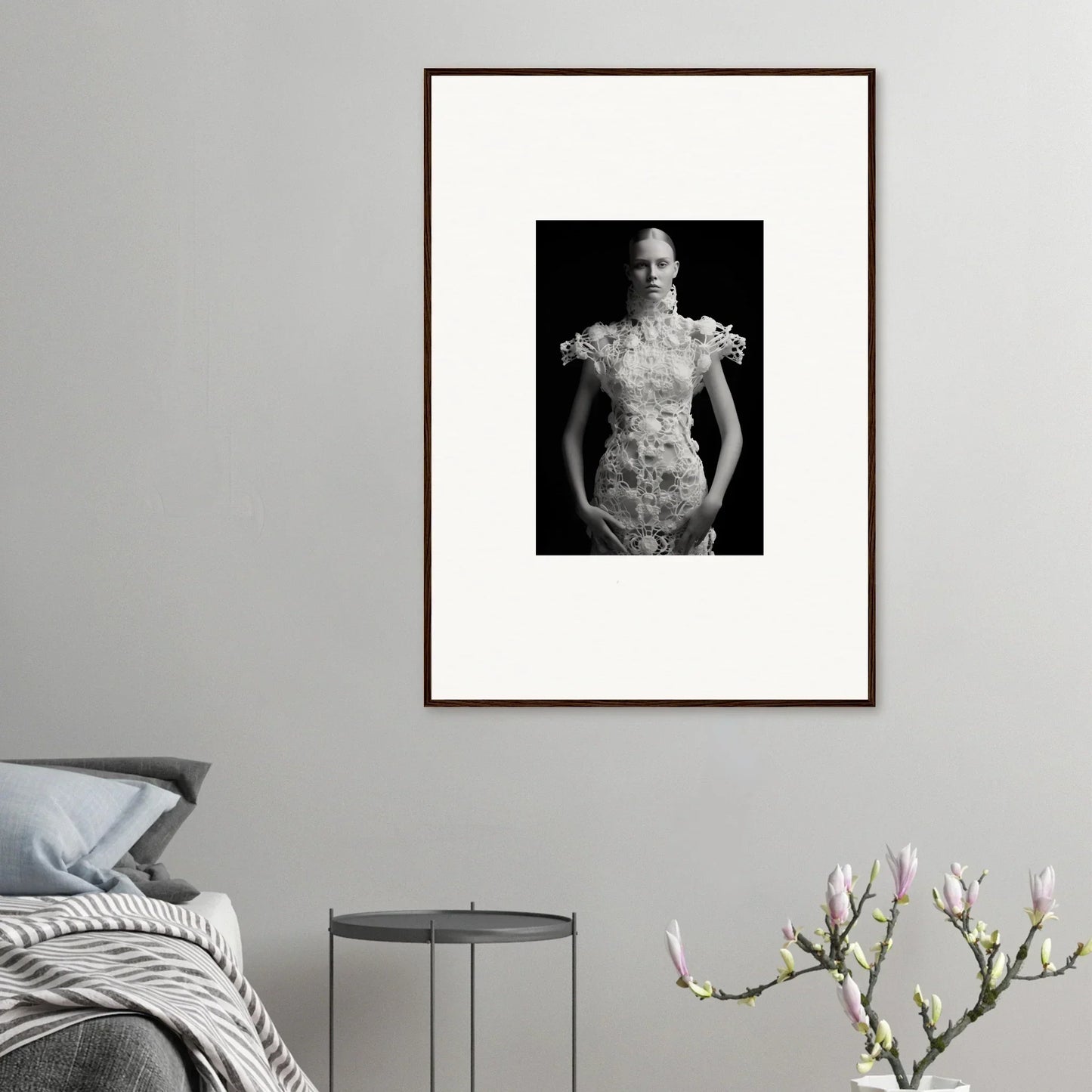 Framed black and white photograph of a person in an ornate white dress for room decor