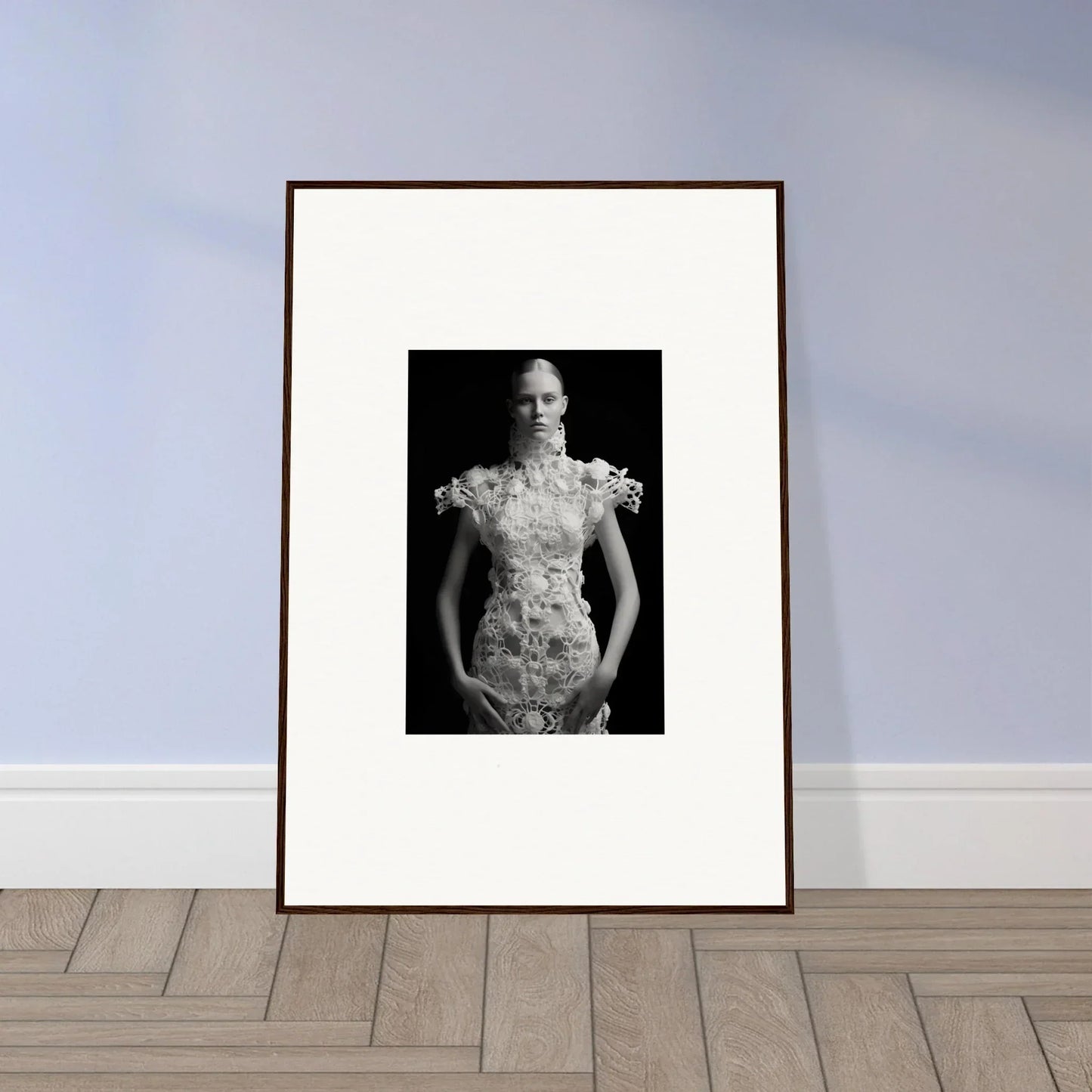 Framed black and white wall art of a person in a floral dress for elegant room decor