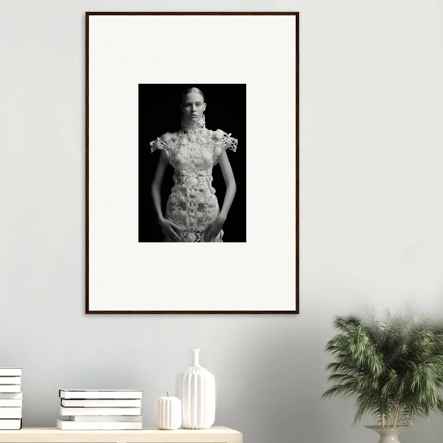 Framed black and white wall art of a person in an ornate floral dress for room decor