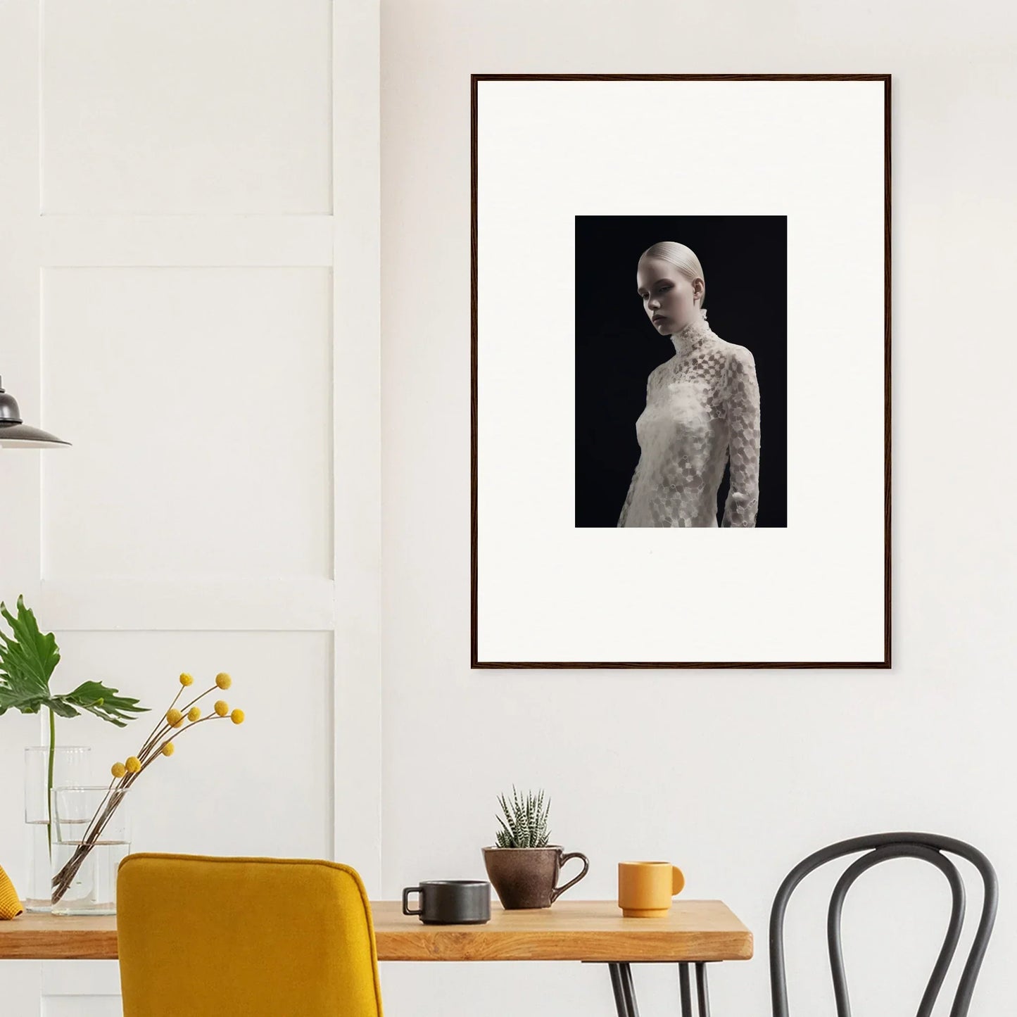 Framed black and white portrait photograph of a person in a lace top.