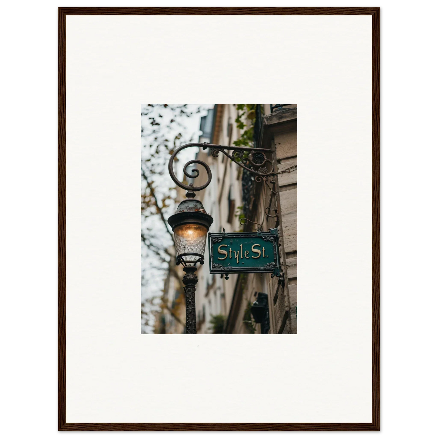Framed photograph of a vintage street sign and lamp post for charming room decoration