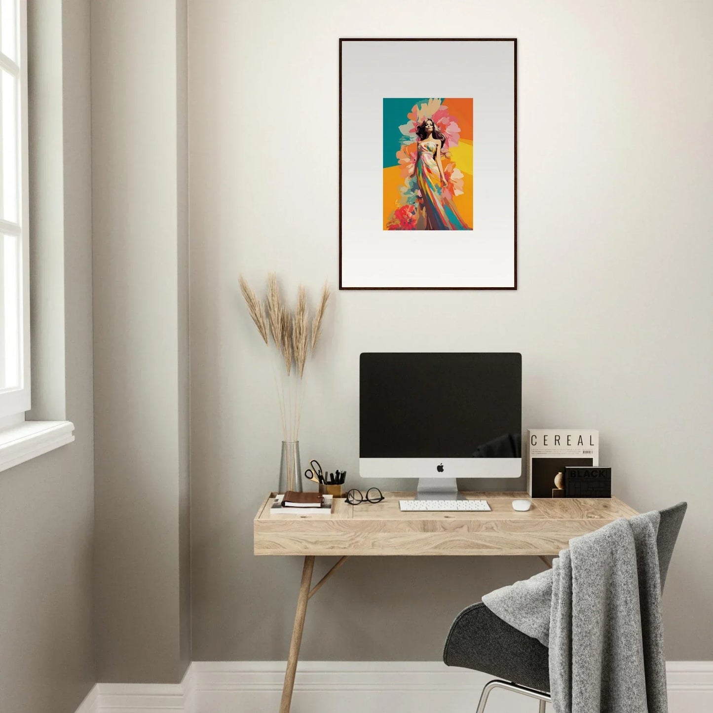 Minimalist home office with wooden desk, computer, and Dream Revelry framed wall art