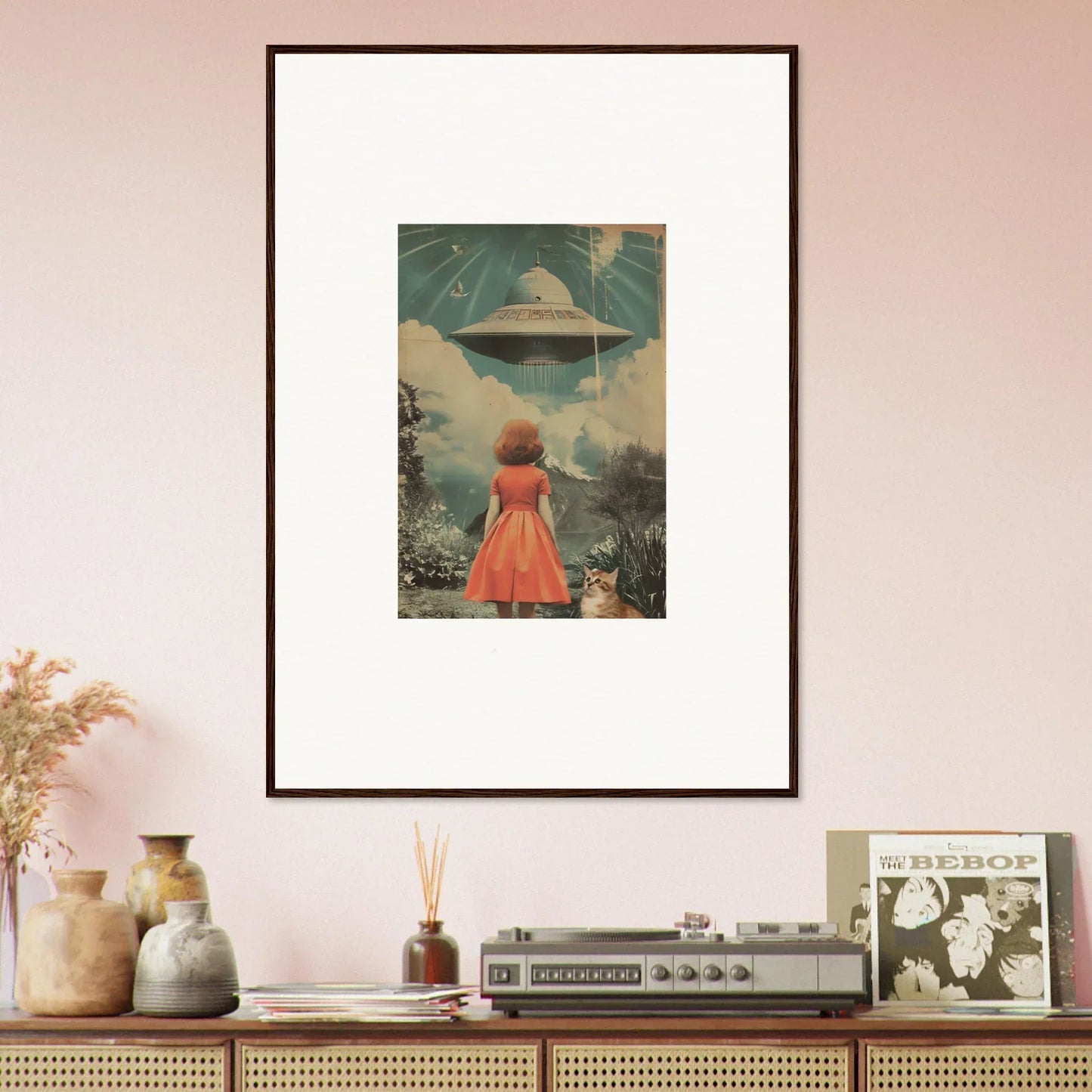 Framed wall art of a person in a red dress facing a UFO for unique room decor