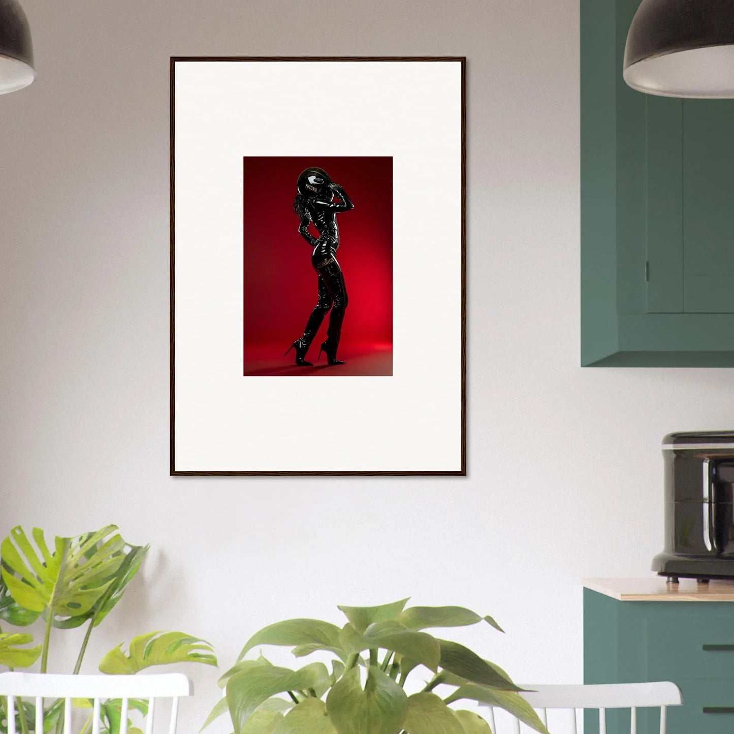Framed artwork depicting a silhouetted figure in a dynamic pose against a red background.