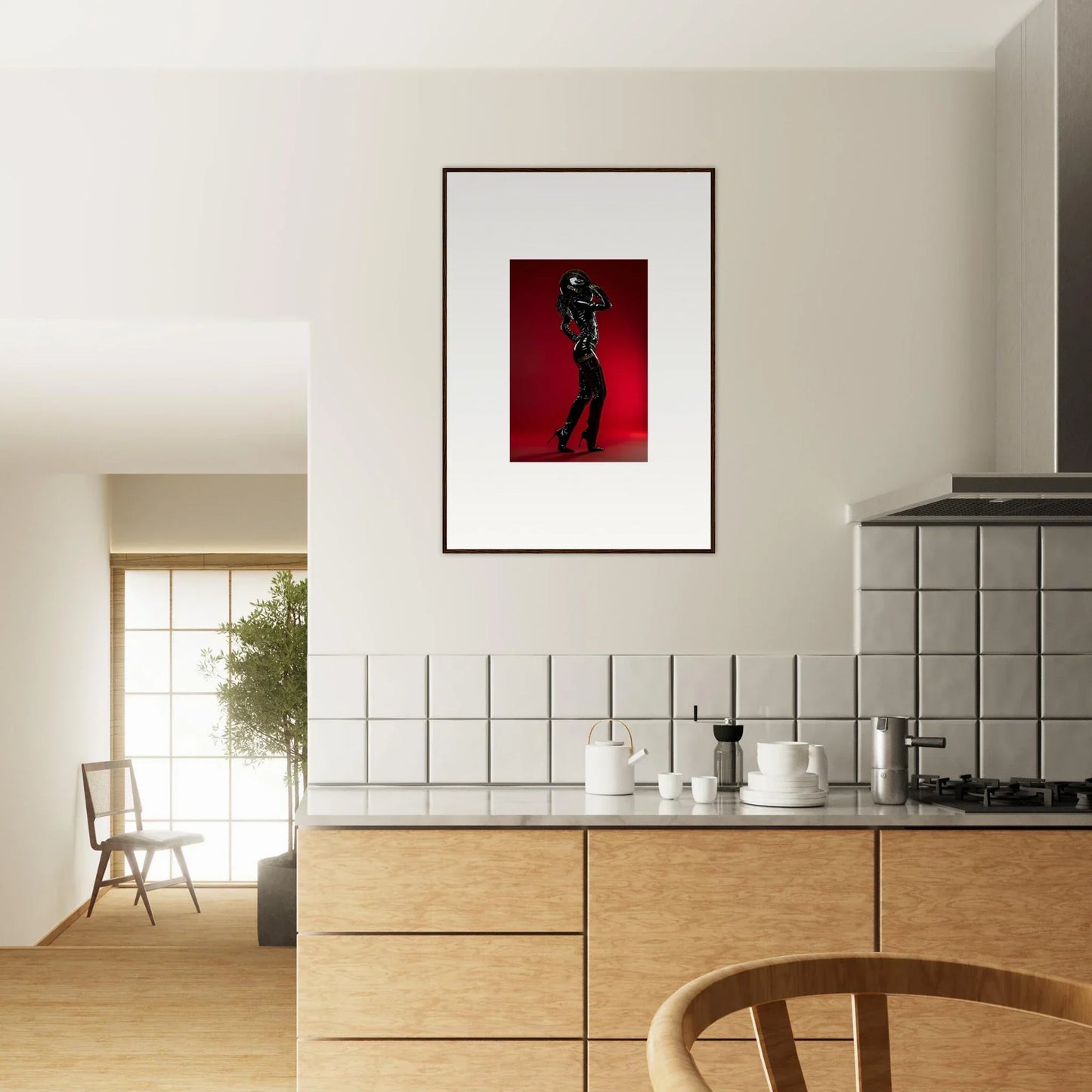 Framed photograph of a silhouetted figure on a red background.